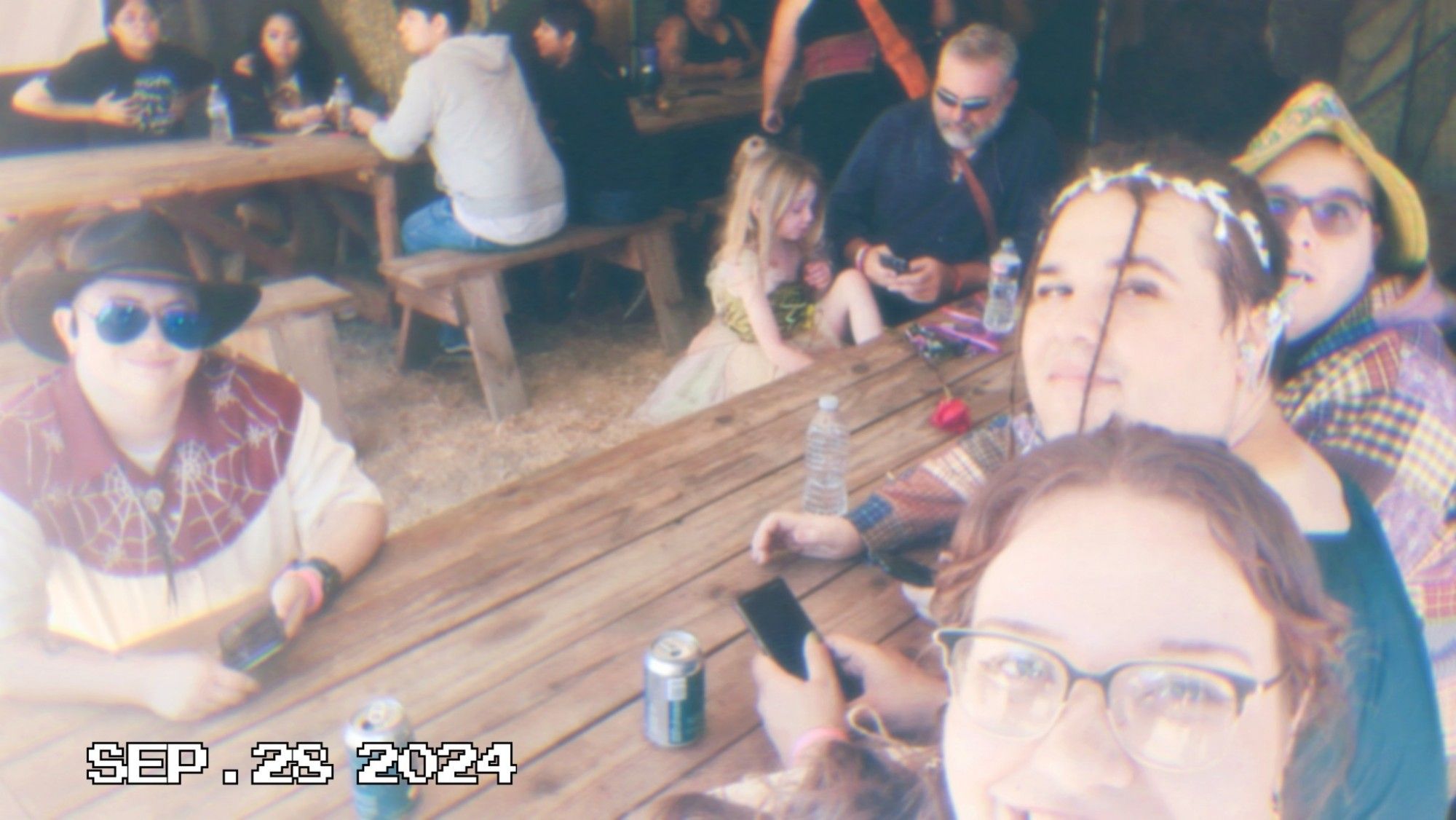 Me, my fiance, her brother, and his boyfriend, all sitting down taking a break from walking around the fair. This picture has a Polaroid filter but was not taken with a Polaroid camera