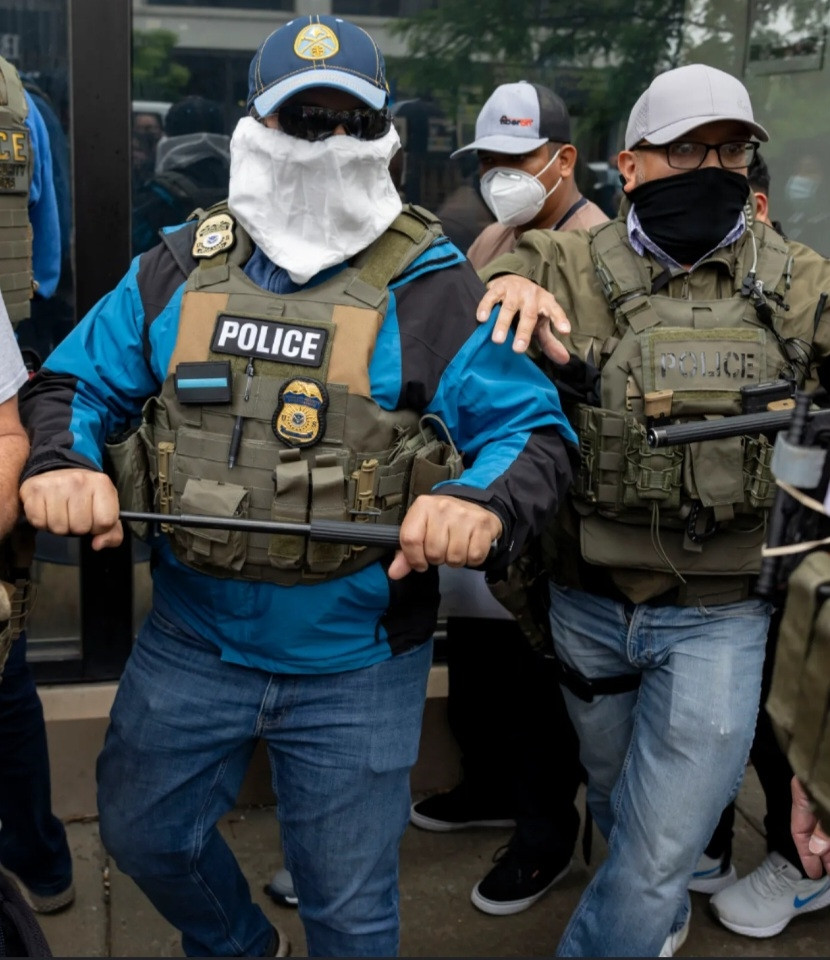 ICE goons with their Etsy accessories and jeans.