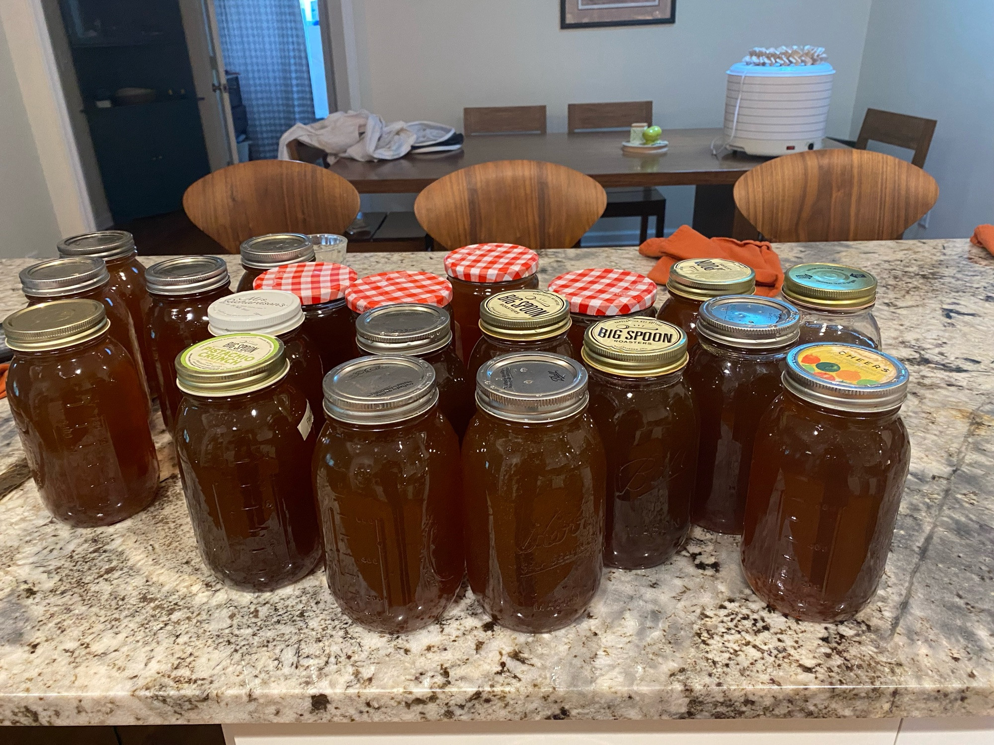 20 quart jars full of honey