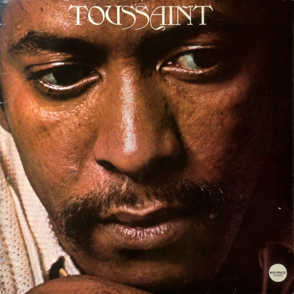 The front cover of Allen Toussaint's album Toussaint shows the artist in close up, a black man in his 30s with a close cropped beard.