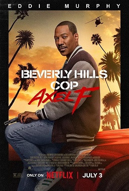 A still of Eddie Murphy as Detective Axel Foley sitting on the bonnet of his car, against a backdrop of Californian palm trees.