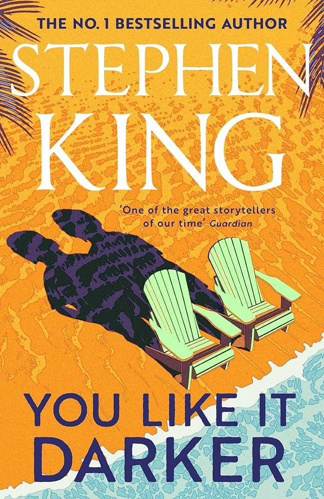 The front cover of You Like It Darker shows a sunny beach with a pair of deckchairs on the shoreline. Although they're empty, their shadows show people sitting in them.,