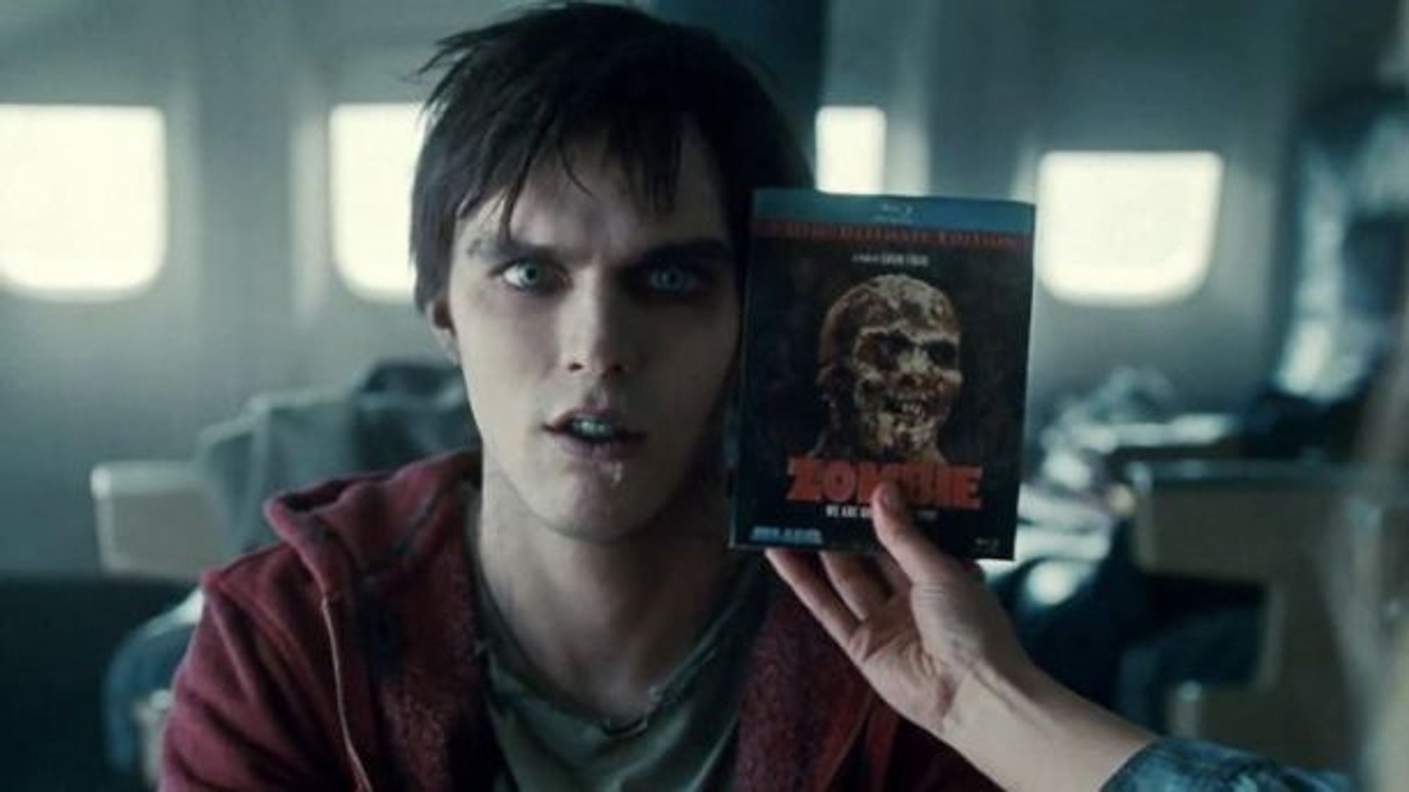 a clip from the movie warm bodies where the girl holds a zombie DVD up to R the zombie's face