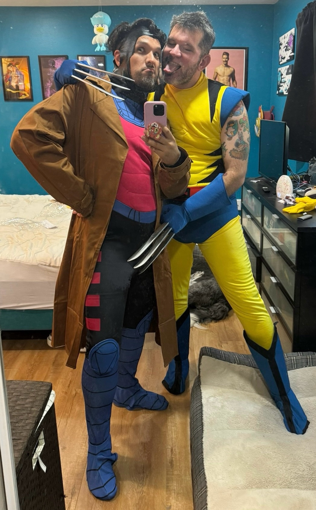 Spirit Halloween Gambit and Wolverine costumes on two dashing men