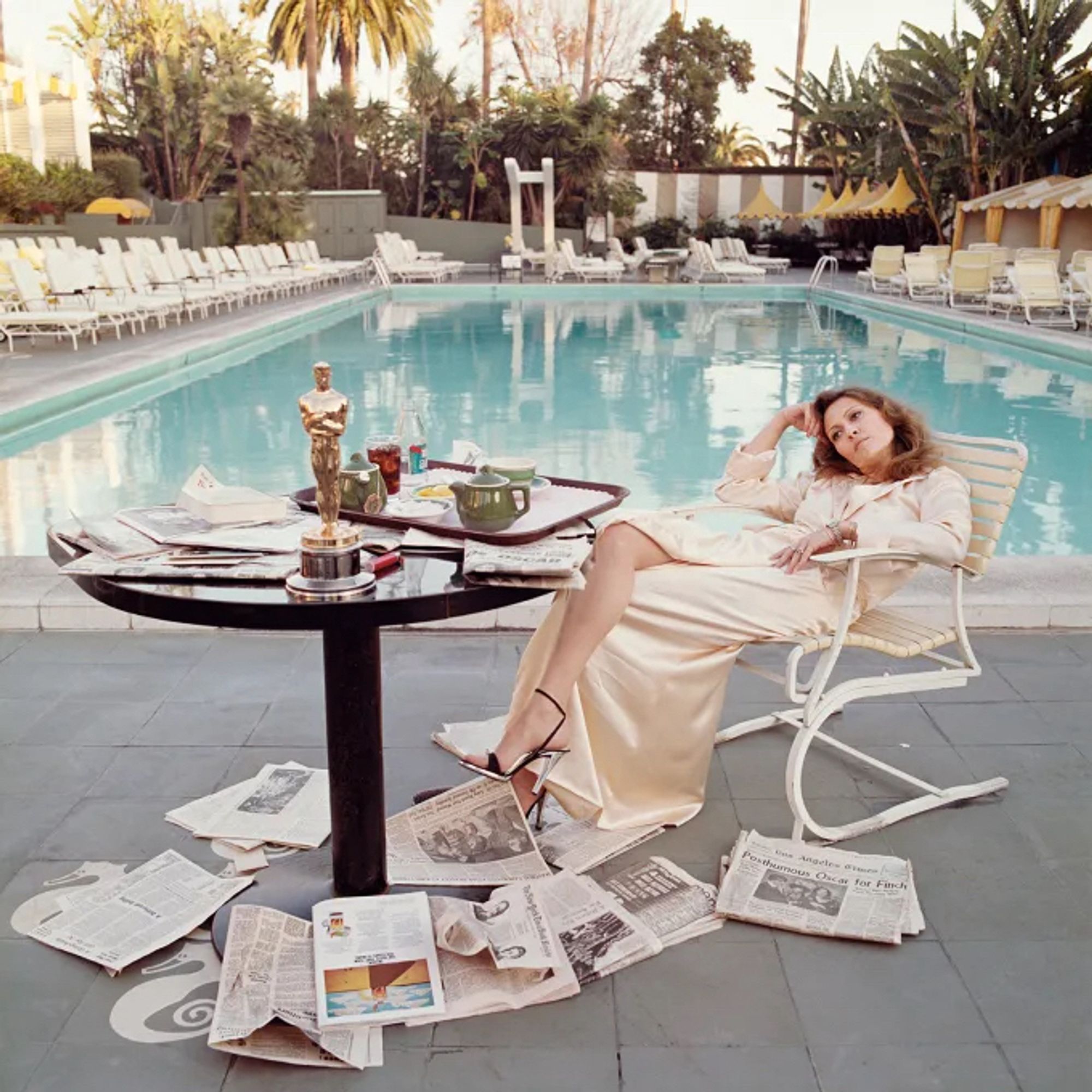 The famous Terry O’Neill photo of Faye Dunaway poolside at the Beverly Hills Hotel the day after winning the academy award for best actress for Network in 1977