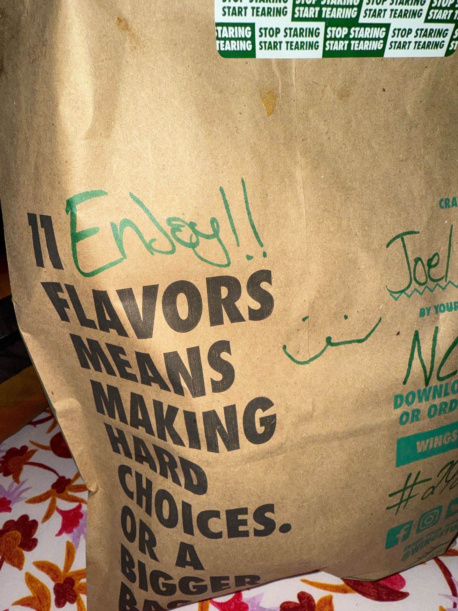 A wingstop bag with a :3 written on it