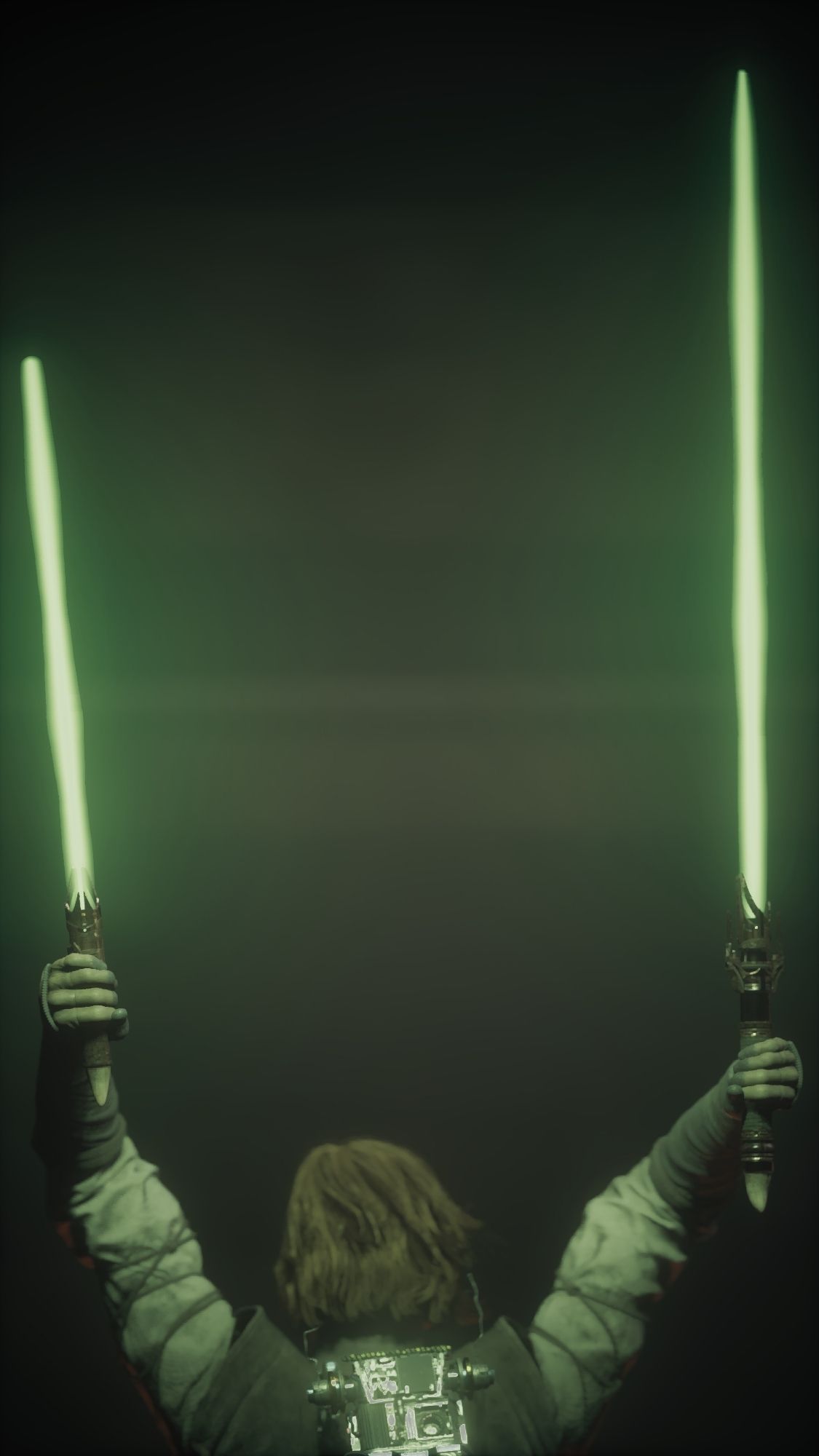 The image depicts Cal Kestis, a Jedi Knight from the video game "Star Wars Jedi: Survivor," standing with his back to the viewer. He is holding two green lightsabers aloft, one in each hand. The lightsabers are ignited, casting a bright green glow on the surrounding area. Cal appears to be in the midst of an offensive attack, with the dual lightsabers raised. The background is dark and obscured, suggesting a chaotic and intense battle.