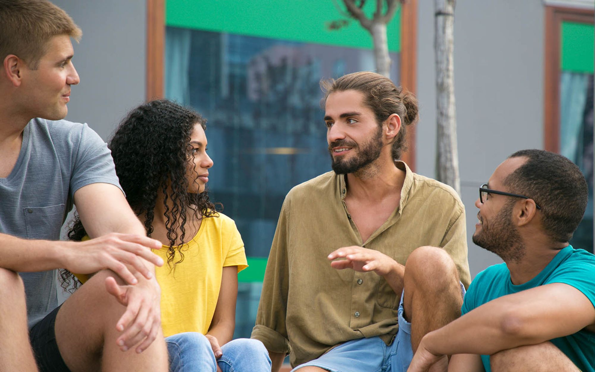 Man sharing news to three friends