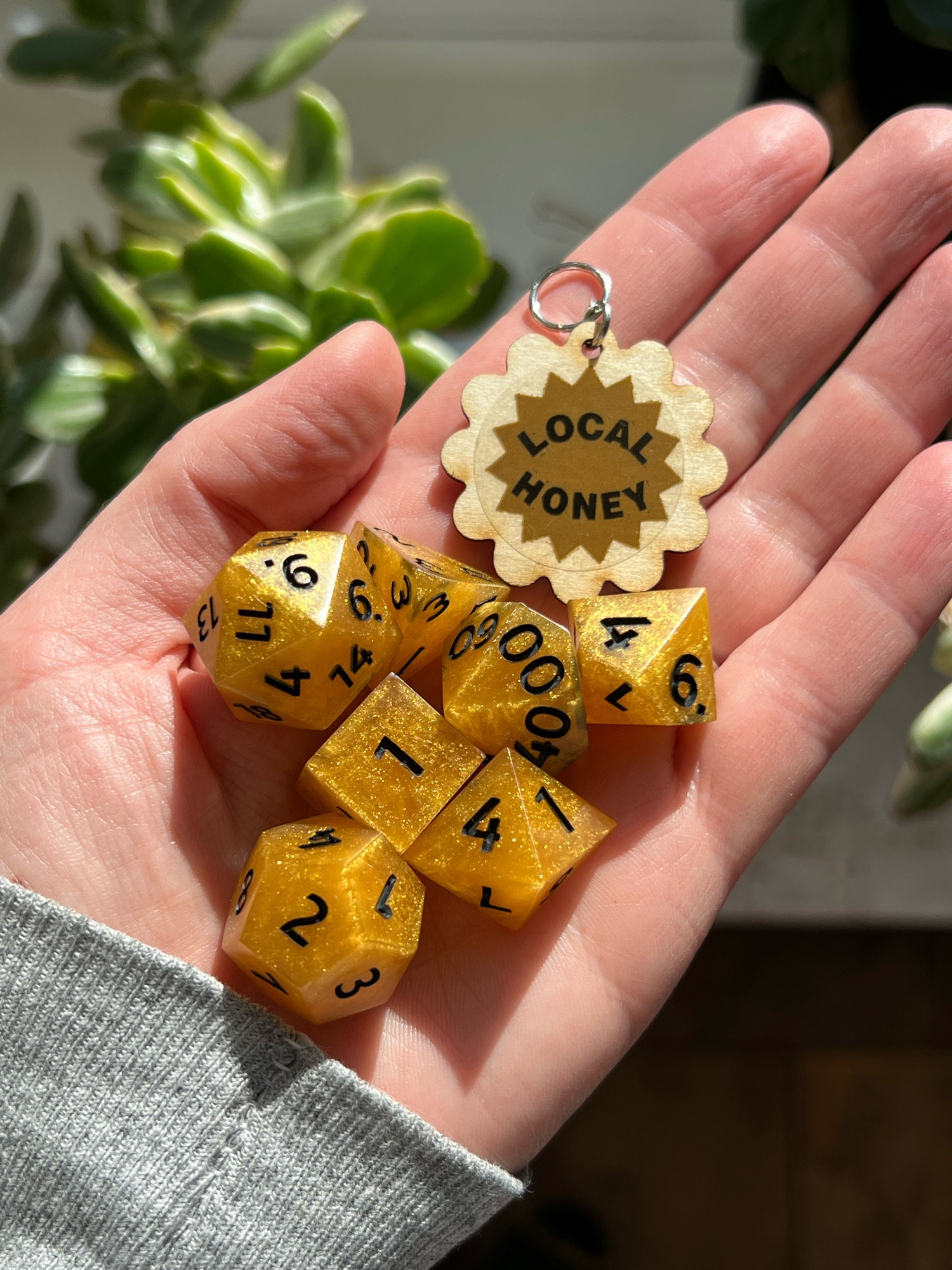 One of the first bee dice sets I made in warm honey gold with black numbers and also a “local honey” wood charm.