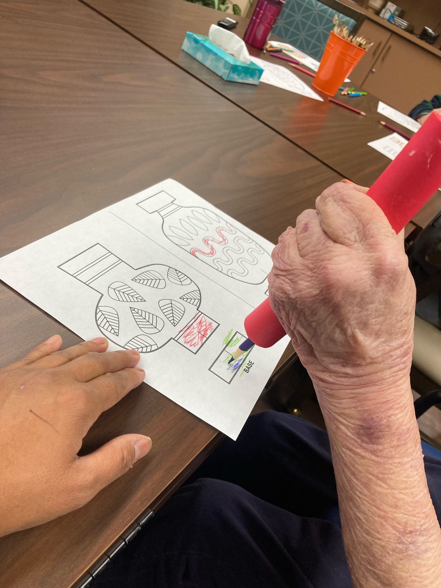 Volunteering at the retirement center. Adapted a tool to help a resident participate in the Mindful Coloring program.