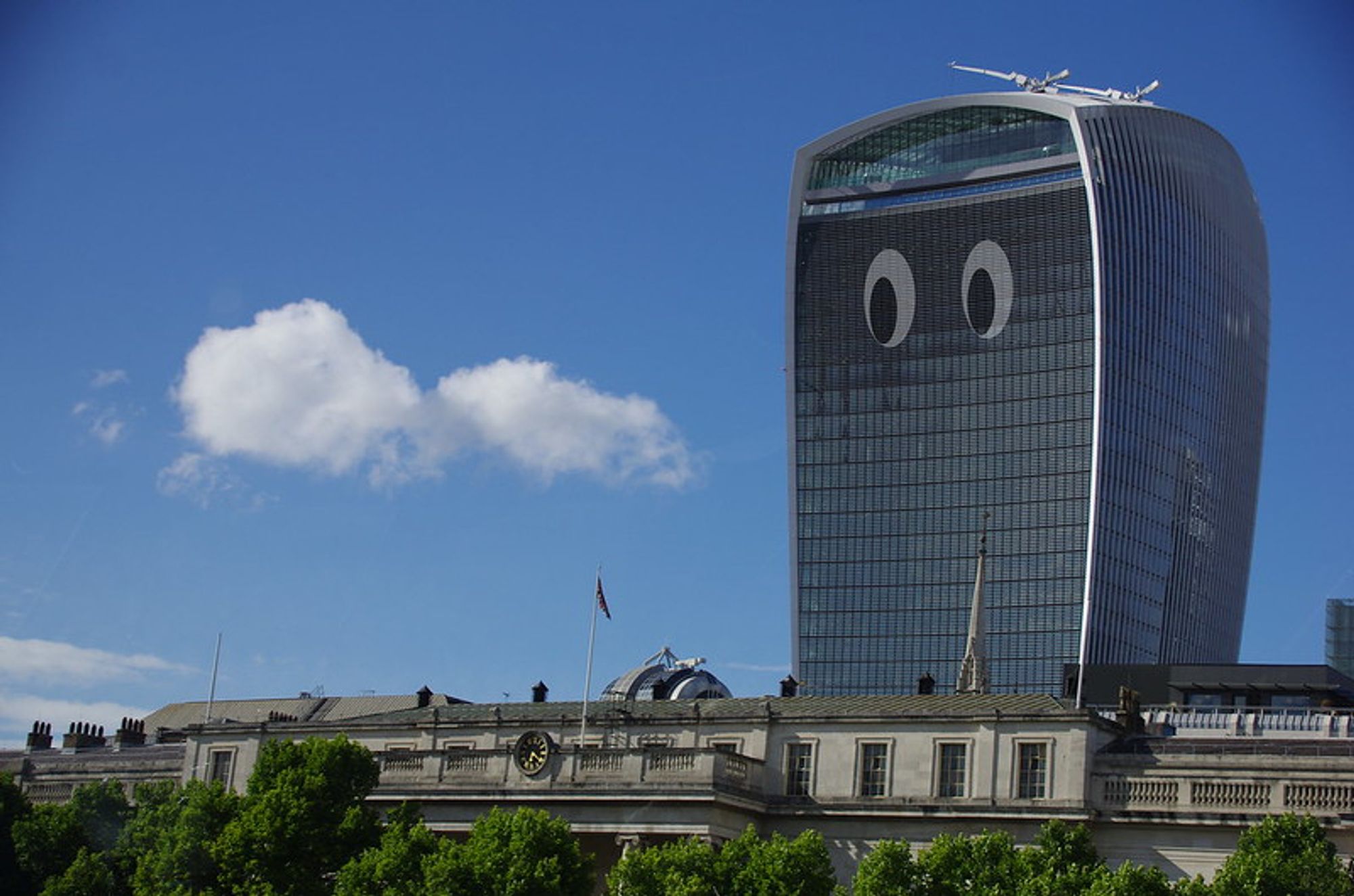 Walky-Talkie skyscraper in London with eyes, I drew on it. They seem to looks at clouds.