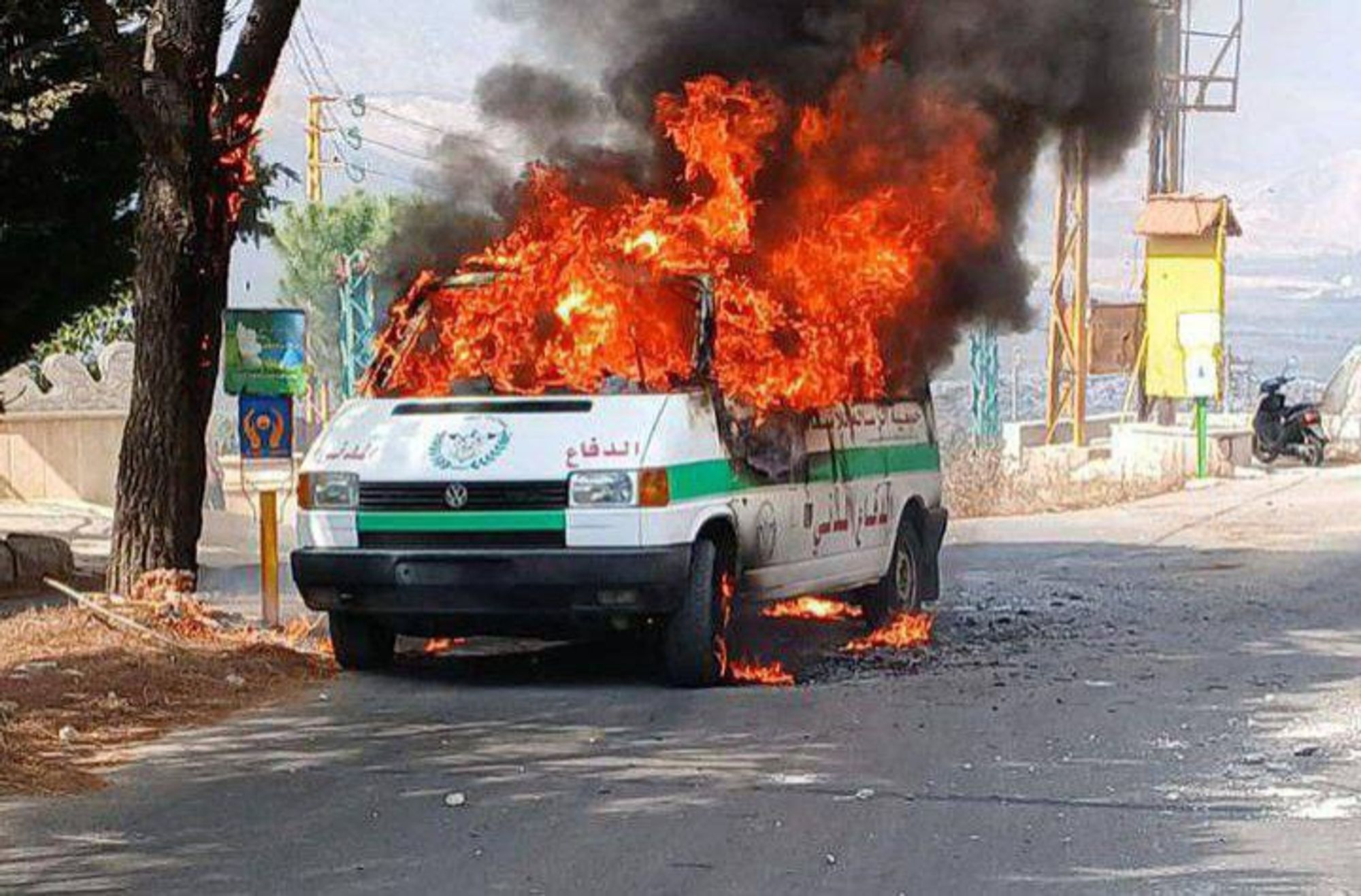 A Lebanese ambulance burns after being hit by an Israeli drone strike earlier today.