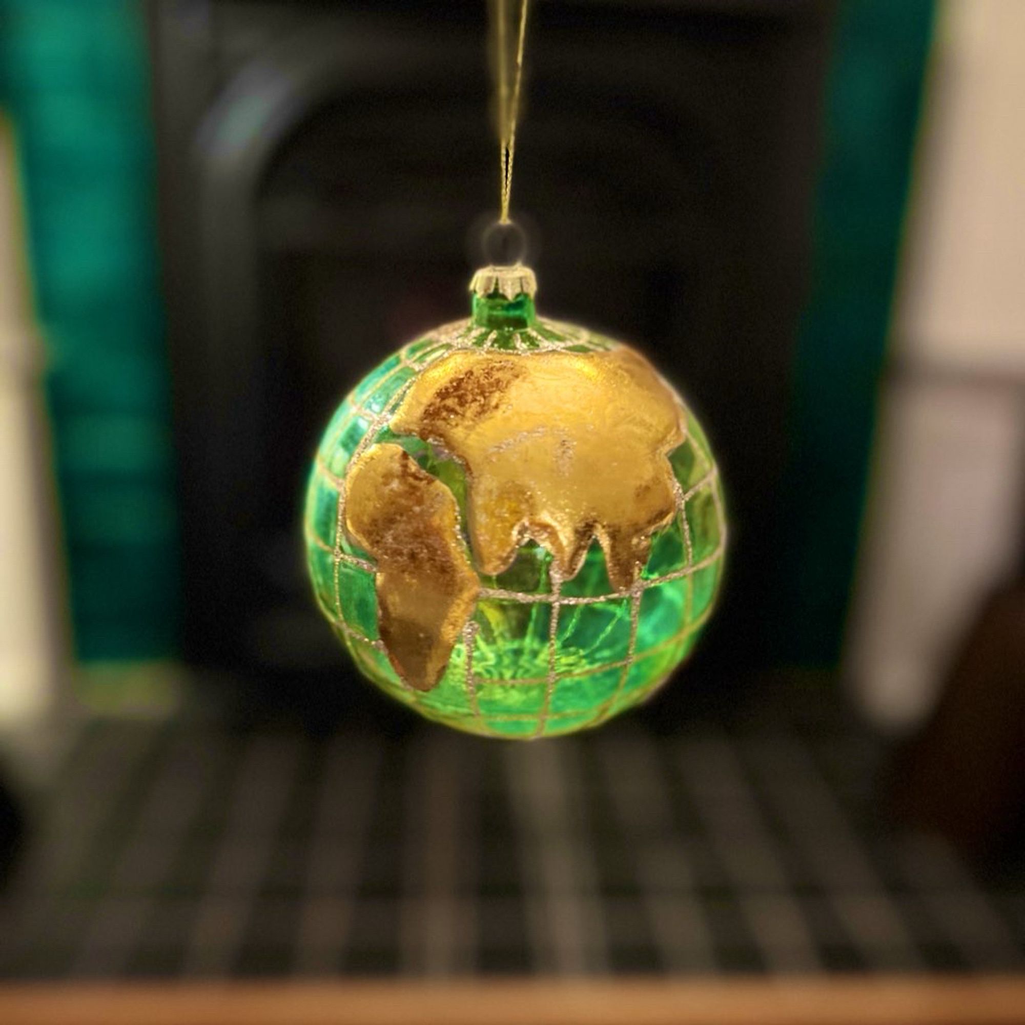 A blown glass world globe ornament.