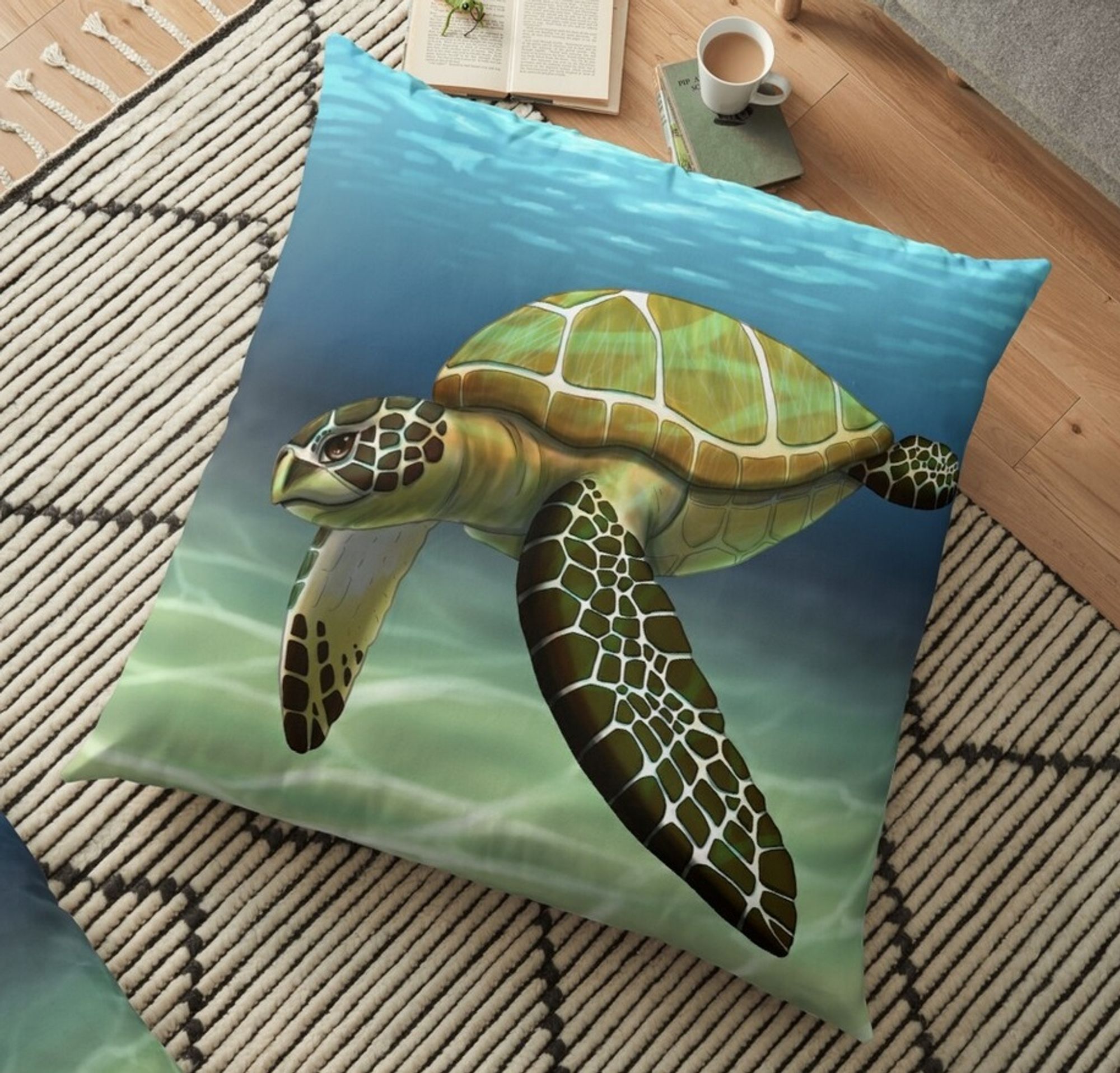 An example image provided by Redbubble. It features a large floor pillow with an illustration of a sea turtle on it. I have some of the pillows so I can guarantee their quality as well, I just don't have this one so I couldn't provide a real photo.