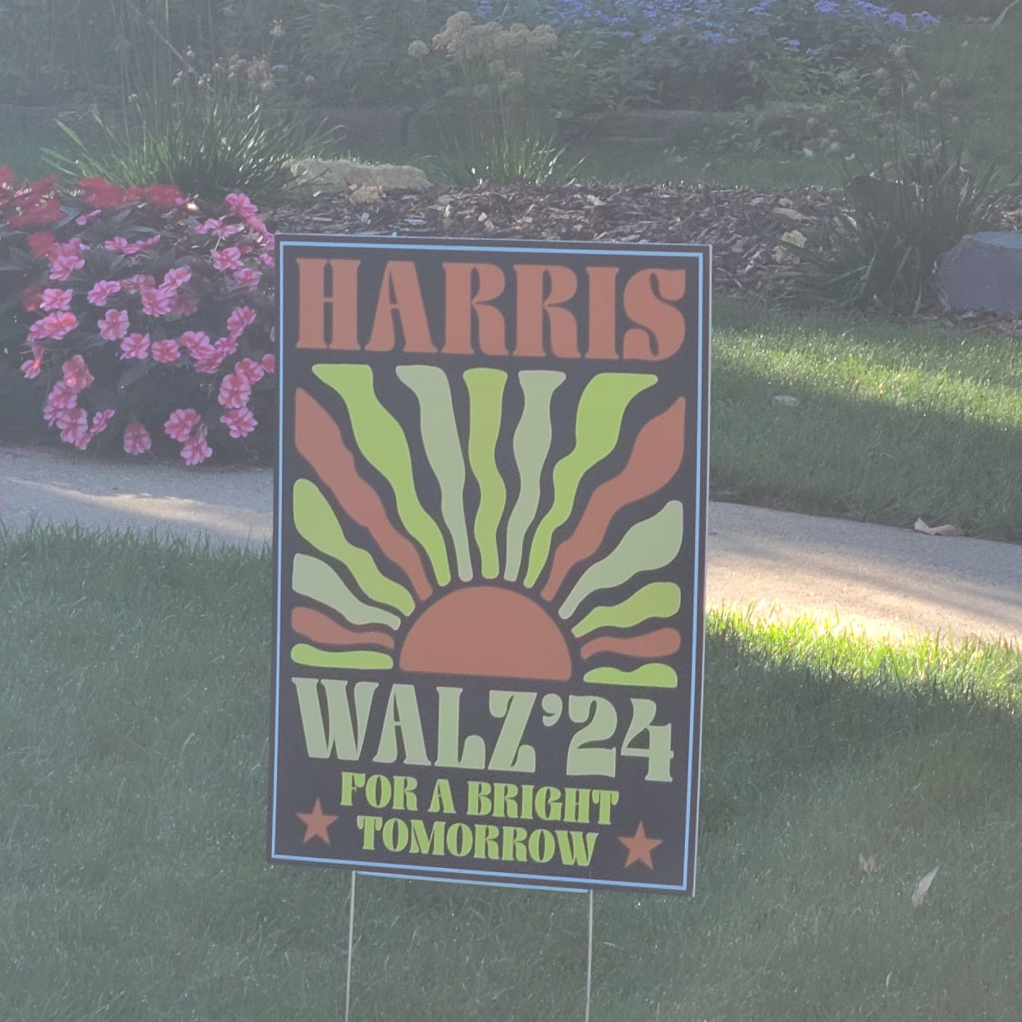 Sun illustration on black background campaign sign harris walz 24 for a bright tomorrow