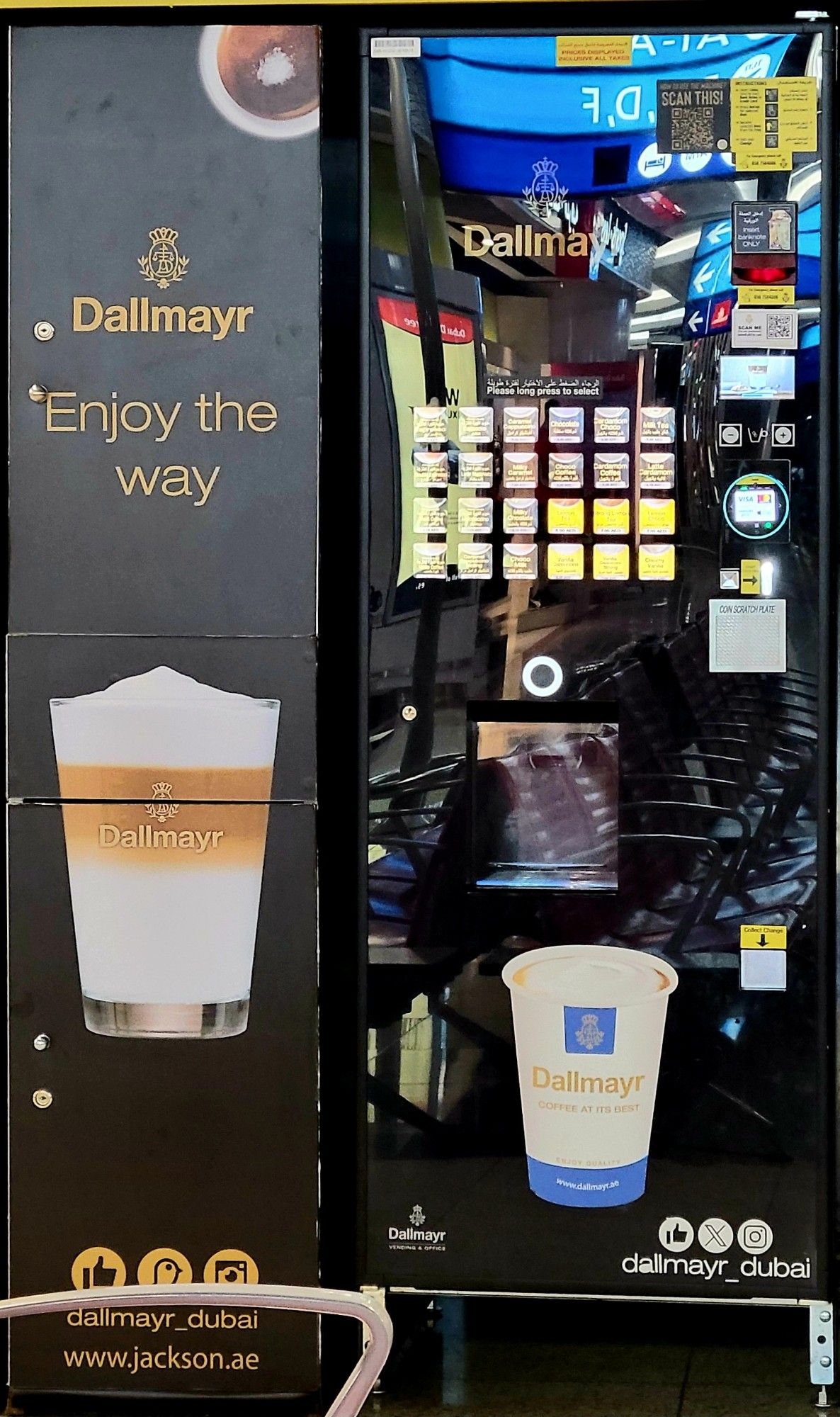 A Dallmayr coffee vending machine. Yellow text on black on the left.