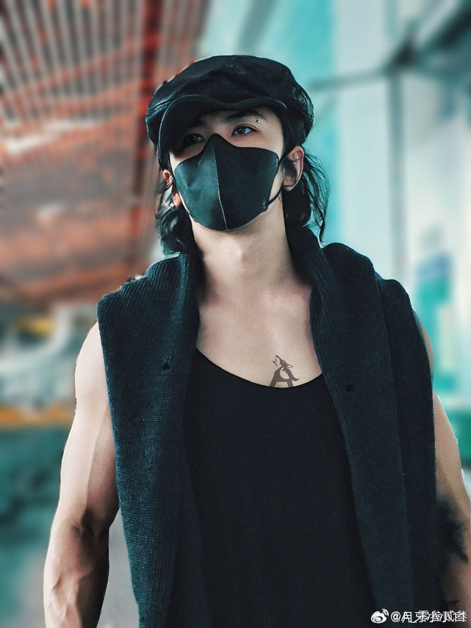 Xiao Shunyao in a black tanktop, sweater whith holes in it over his shoulder,  paperboy cap, and face mask at the airport