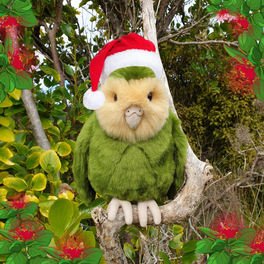 A kākāpō soft toy on a branch, with NZ Christmas graphics added. Credit: Jodie Crane / Andie Gentle.