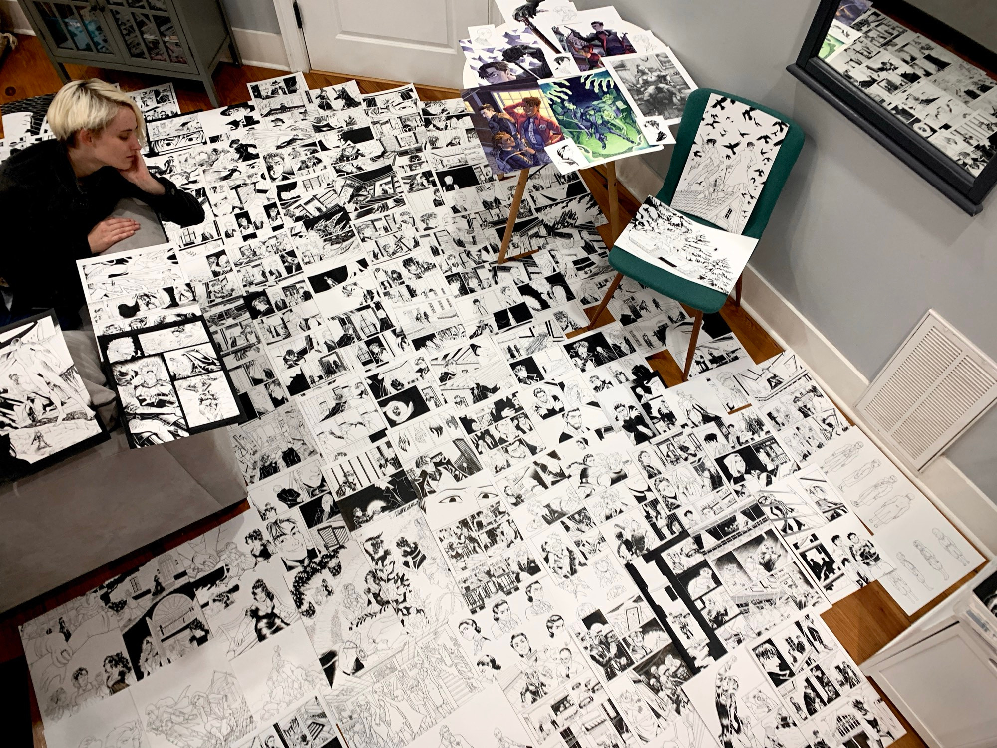 Around a hundred traditional comic pages spread out on the floor and furniture of my old apartment. I sit on the couch looking over the mess.