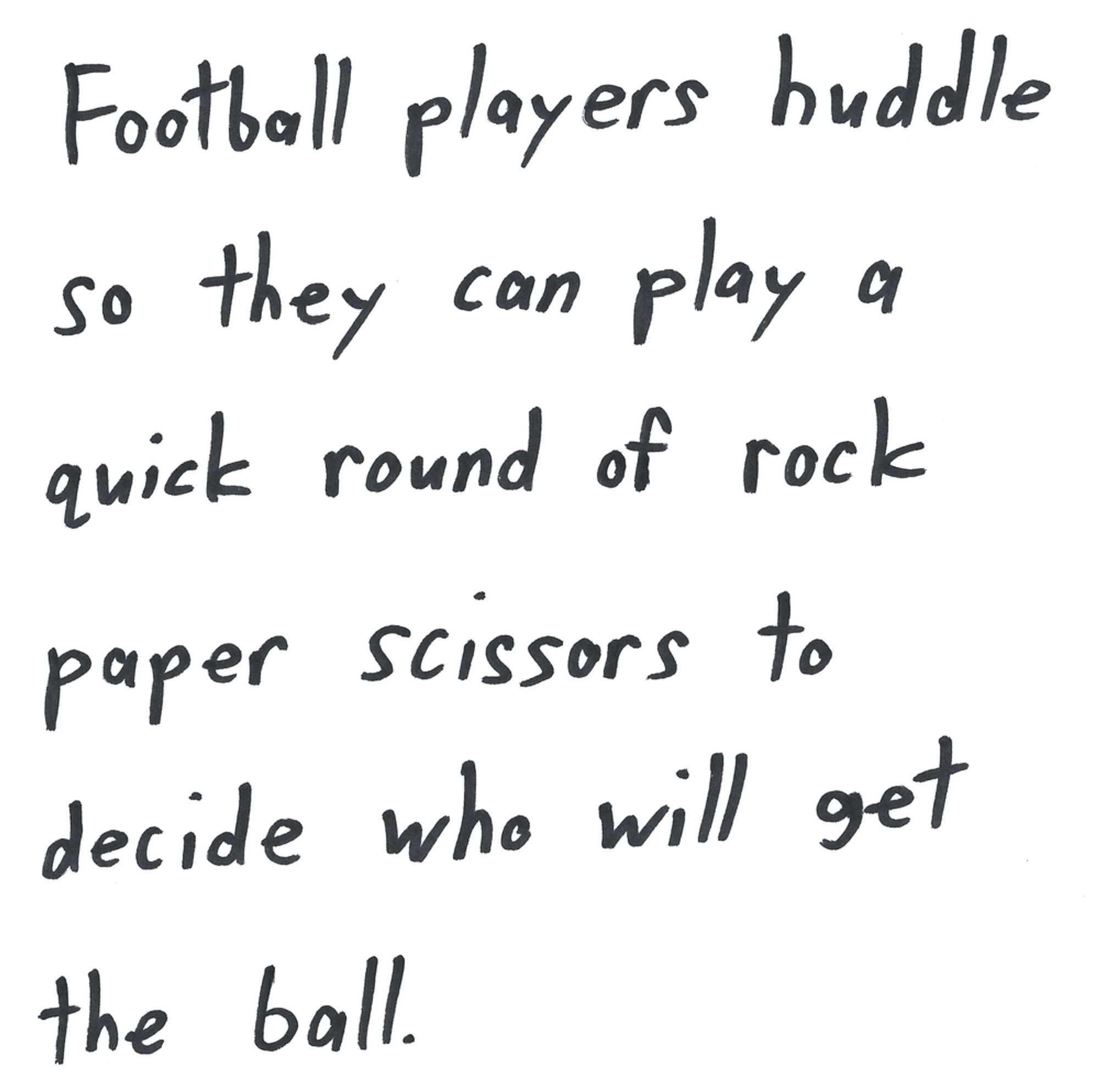 Football players huddle so they can play a quick round of rock paper scissors to decide who will get the ball.