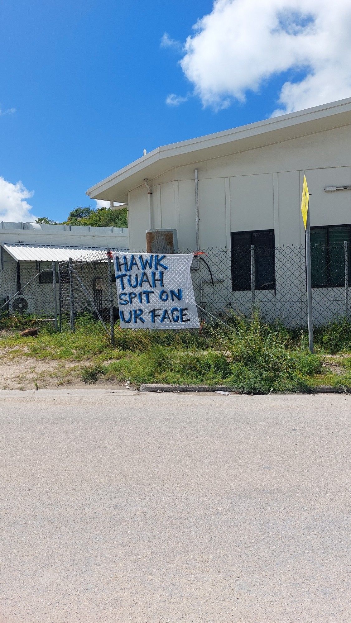 Sign saying hawk tua spit on your face. Nauru.