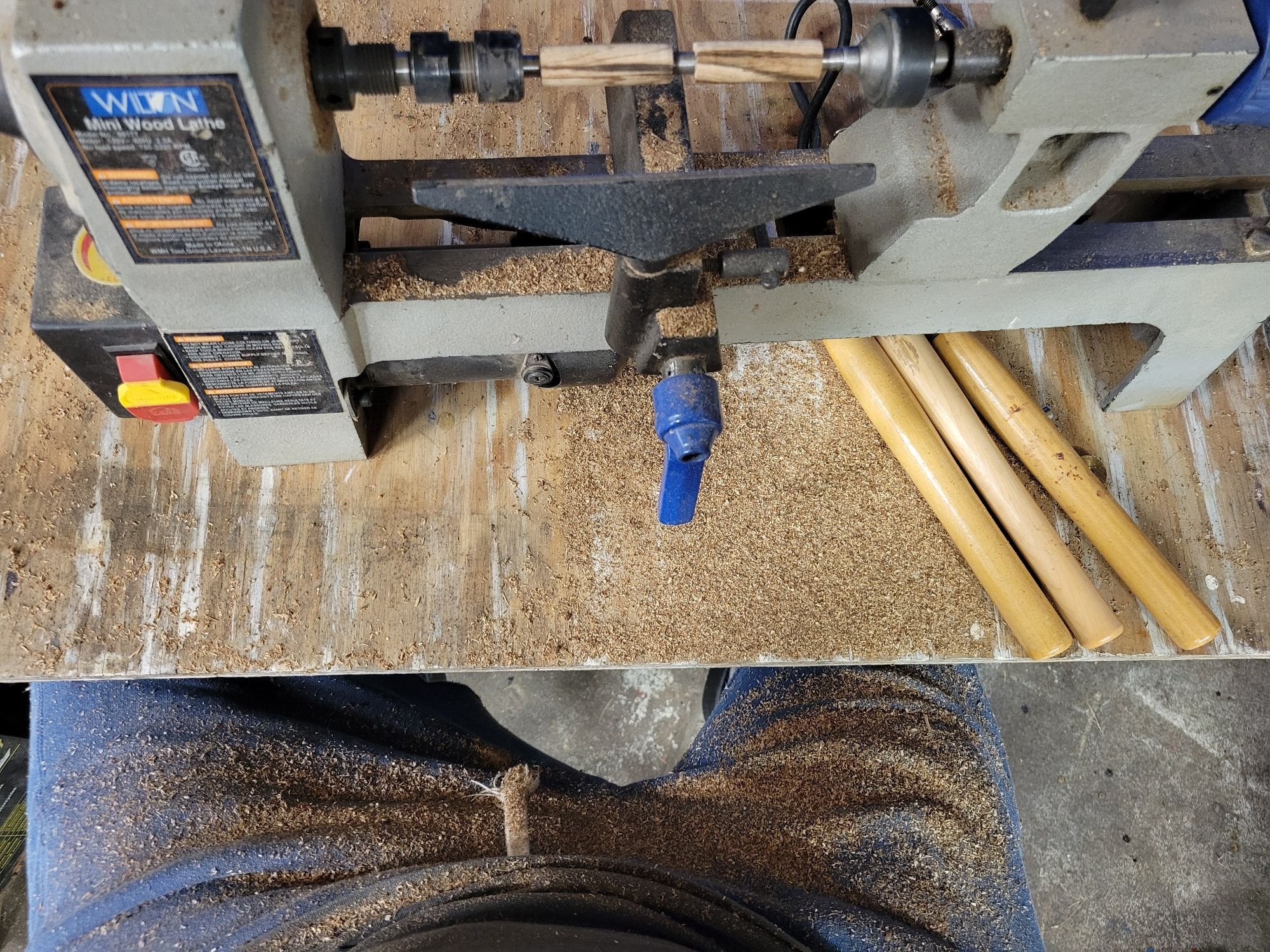 Sitting in front of my lathe covered in sawdust from carving wood for pens