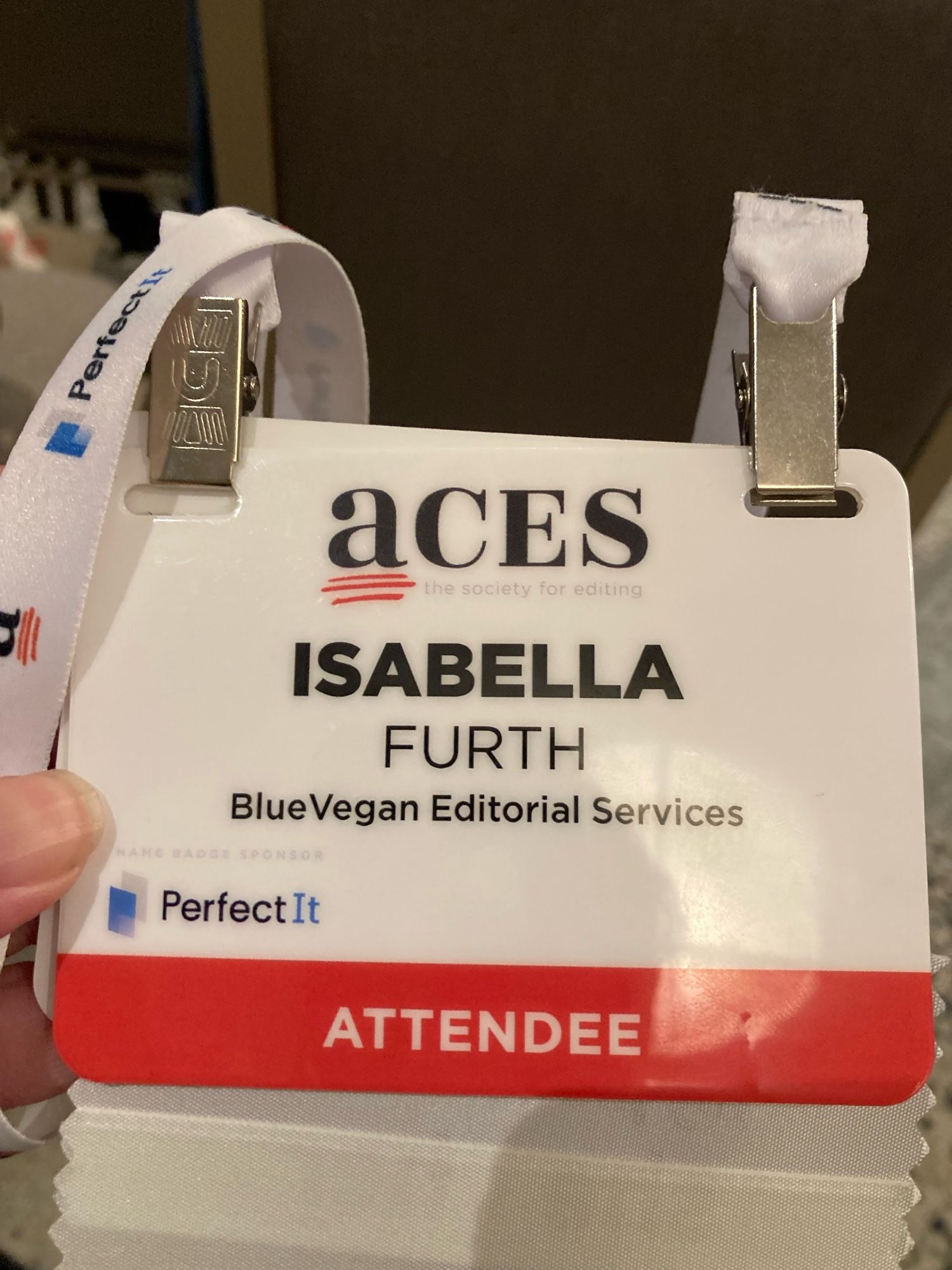 Conference badge listing company Bluefish Editorial Services as BlueVegan Editorial Services