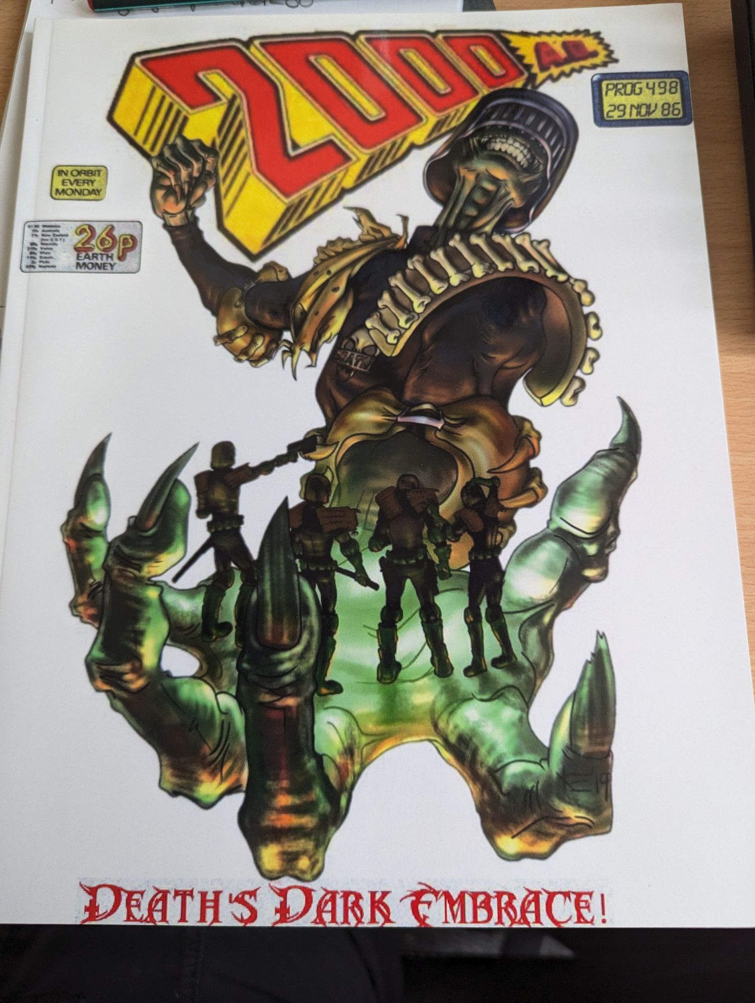 A home made 2000AD issue with Judge Death on the cover, written by Steve Ray and illustrated by Kaye Elling. Judge Death is holding 4 Judges in his palm and raising the other fist to crush them.