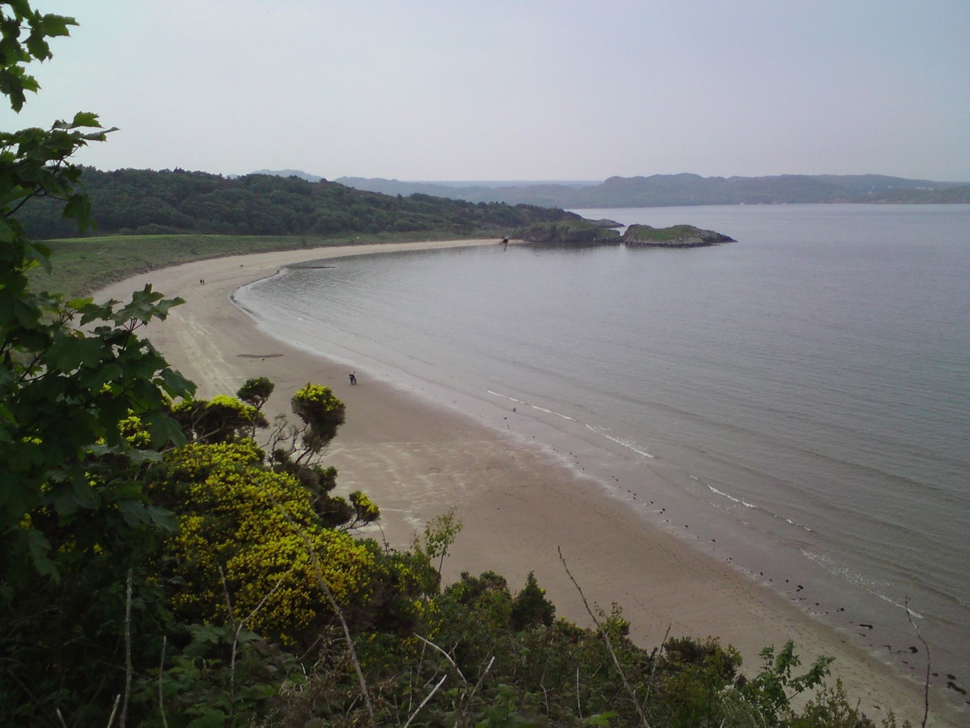 Gairloch beach in slightly dull weather. Long sandy beach. Photo taken from a viewpoint on a path leading down to the beach. 2014.