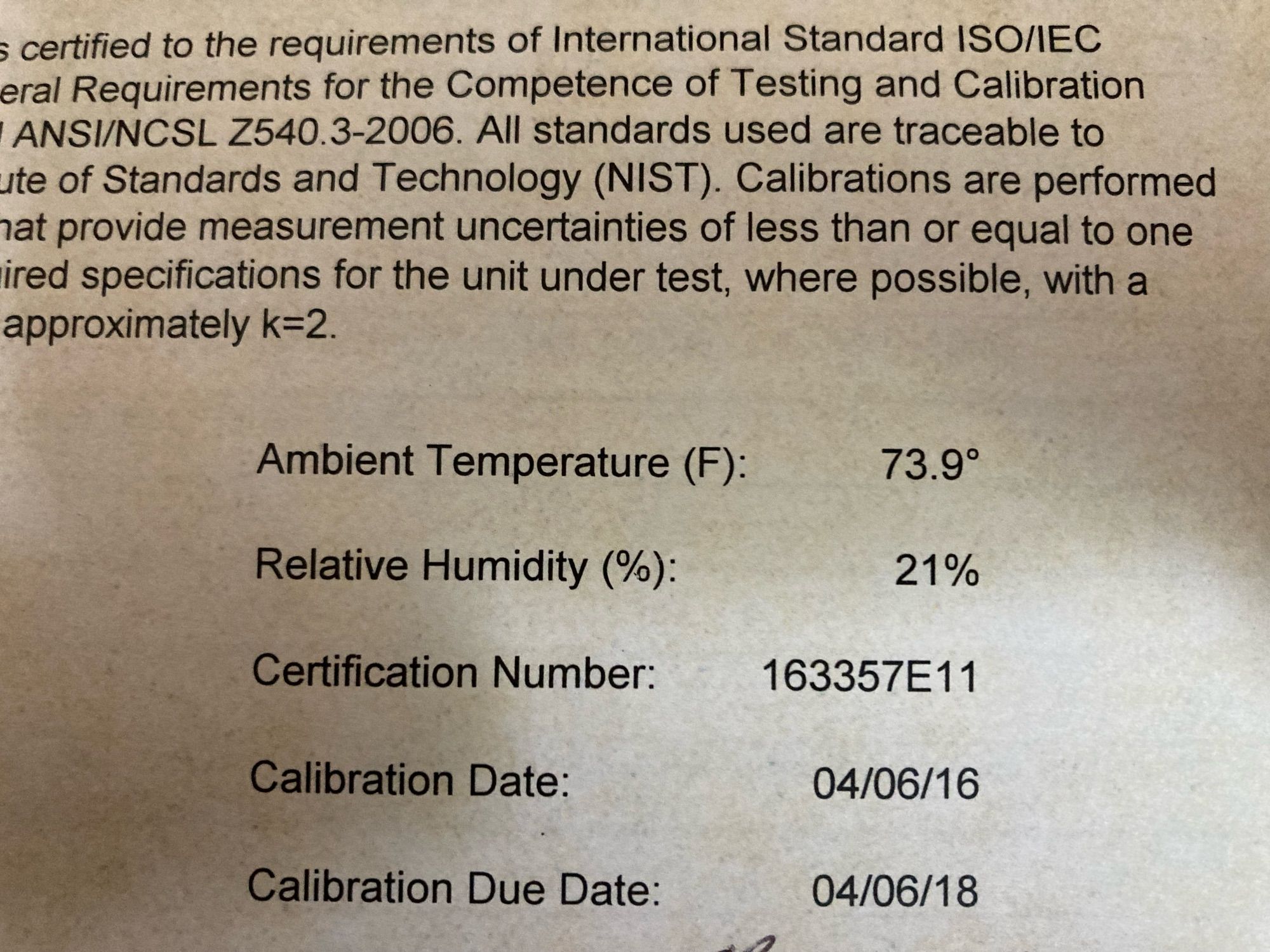 a photo of a device calibration certificate, showing the ambient temperature, relative humidity, certification number, and calibration date of April sixth, 2016.