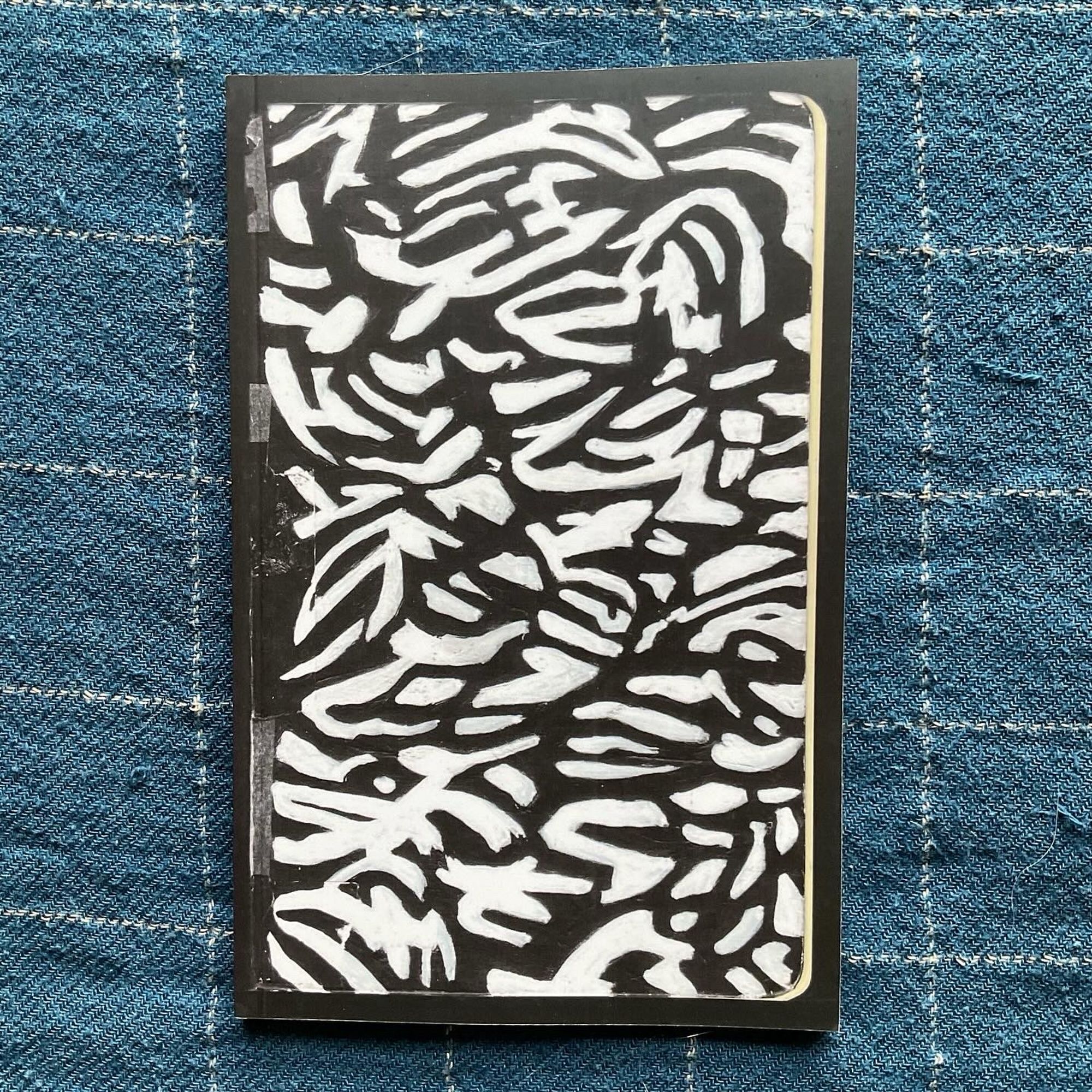 The cover for Driven by Lemons, a black and white abstract painting.