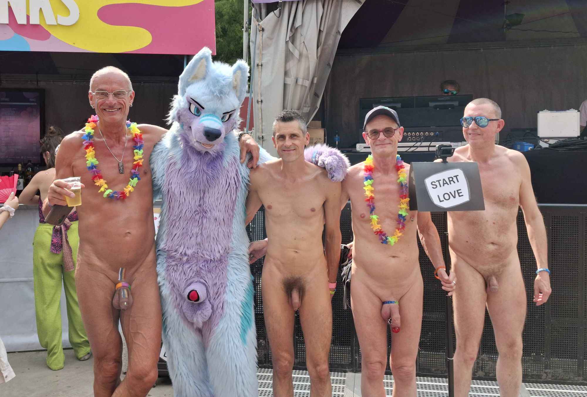 Group photo of 4 nudists and Keenora in his softsuit also showing his plush dick