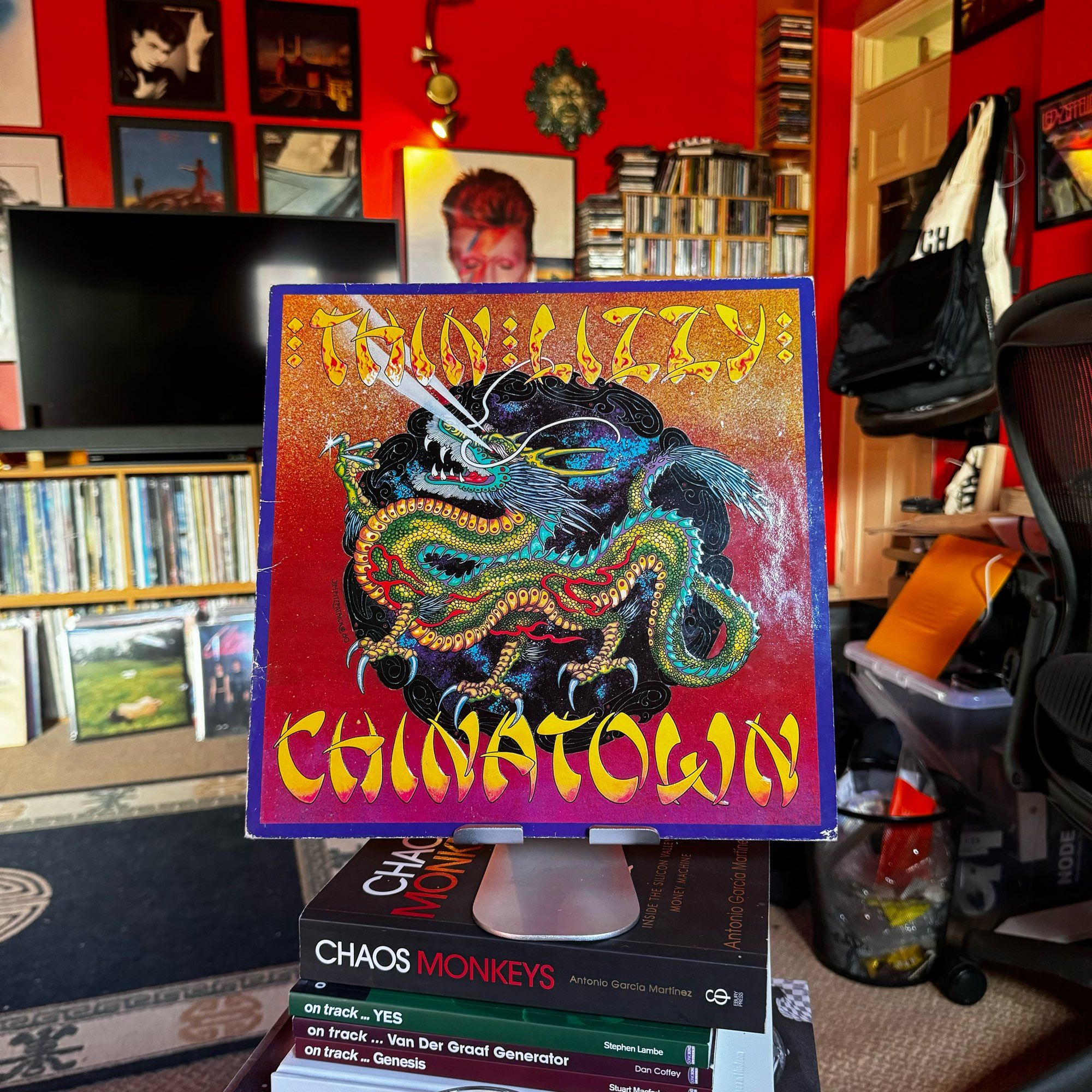 Cover art for Thin Lizzy Chinatown and a three toed dragon depicting the triads.