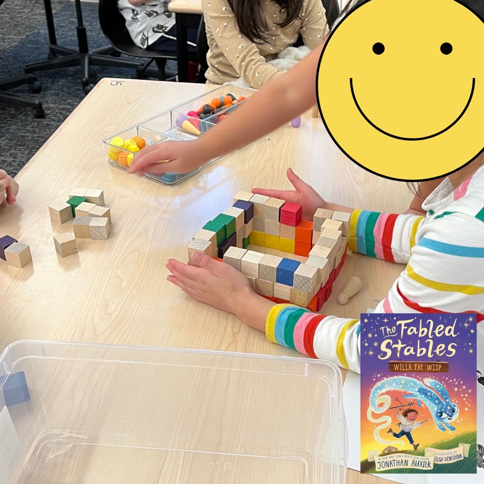 Students building with wooden blocks.