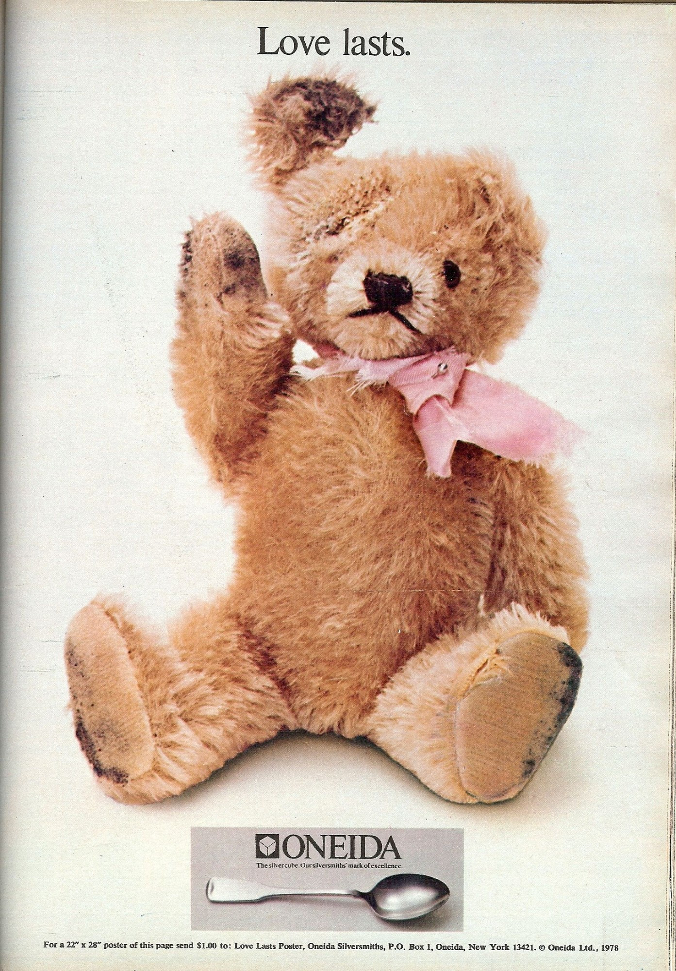 Poster with "love lasts" across the top, featuring a very worn teddy bear. In a small text box at the bottom is a photo of a teaspoon with the Oneida silverware name and logo.