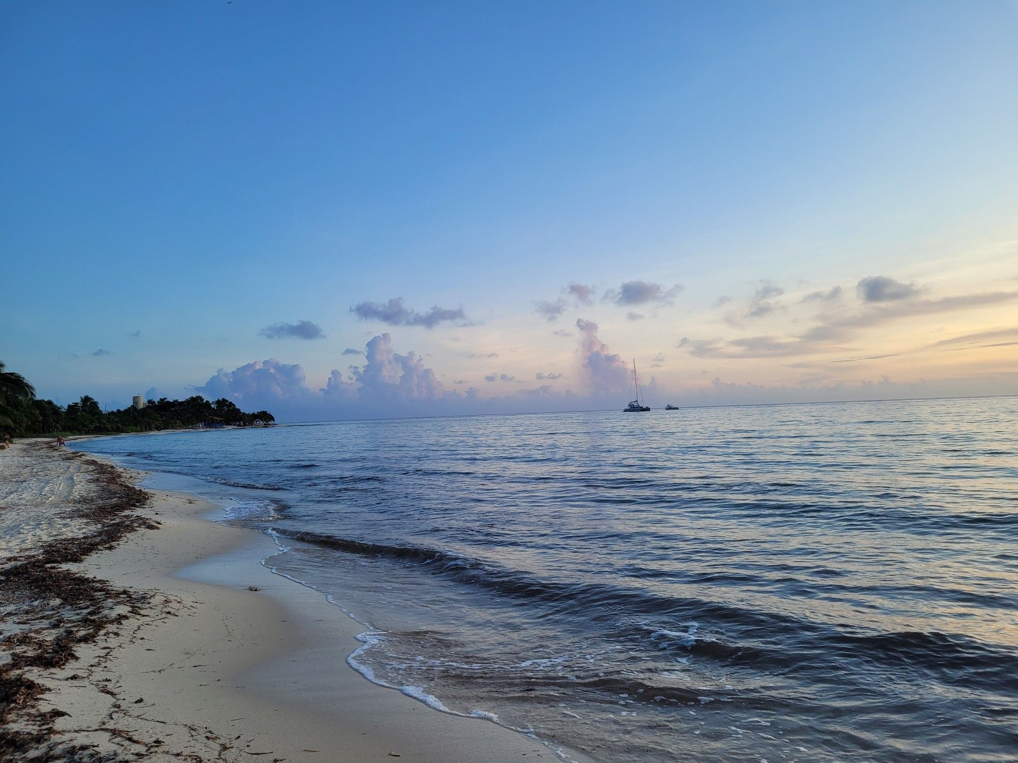 The beach, ocean and sky at sunset in Cozumel, Mexico.