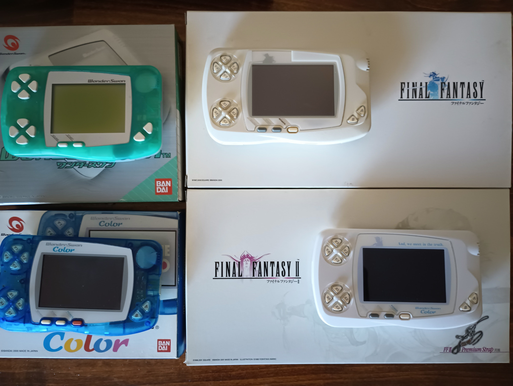 Wonderswan, Final Fantasy Wonderswan, FF2 Wonderswan, and blue Wonderswan Color all sitting on their retail boxes