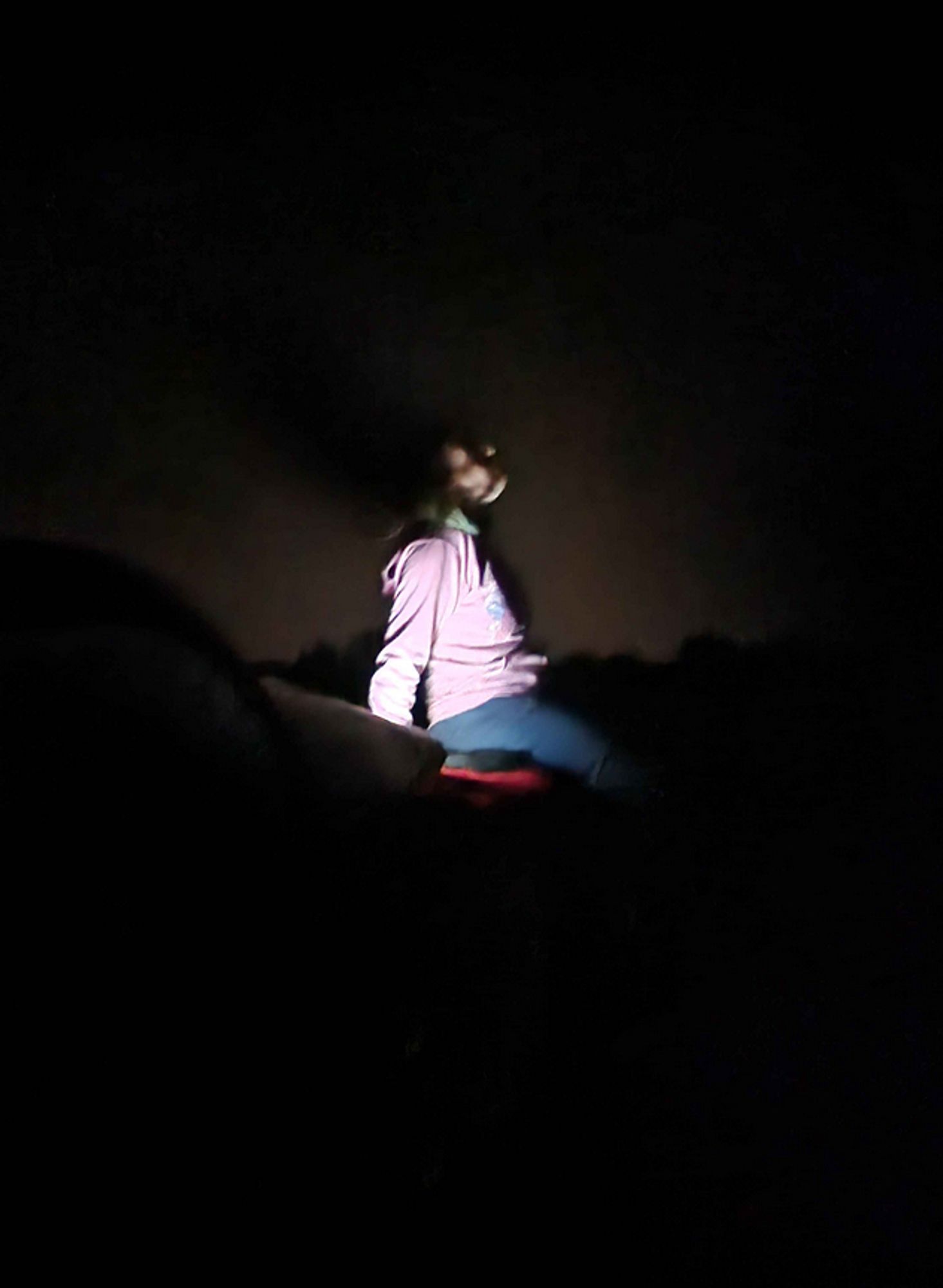 picture of sedeto in the night, her face is covered by black fog with weird light on the face