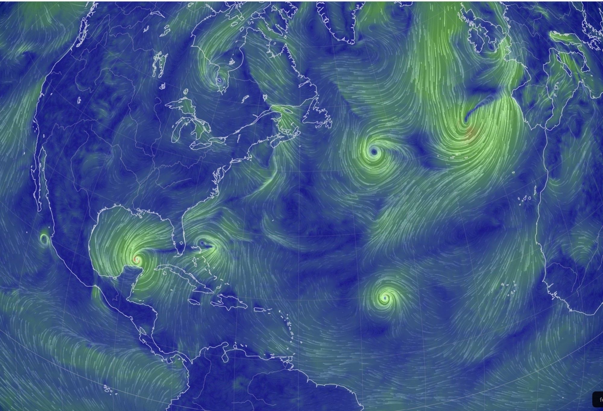 Image from earth.nullschool.net showing wind patterns and speeds in shades of yellow and green, overlaid on a blue map of the North Atlantic with North America and the Northernmost portion of South America on the left, the British Isles and Europe southwest of the Alps in the upper right corner, and west Africa on the right edge.  
Visible are several low pressure center concentrations of high speed winds surrounding tropical storms and hurricanes.  One is immediately north of the Yucatan, one is north East of the Bahamas.  One is in the mid Atlantic at the latitude of the Lesser Antilles,  One is in the north mid-Atlantic at the latitudes of Spain and New England.  One is off the coast of Western Europe.   A small one is off the West coast of Mexico.  Another low pressure storm system is above Hudson Bay.