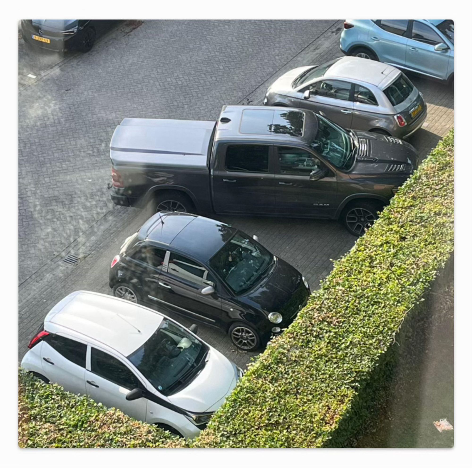 A truck parked sideways taking up two spots made for small cars. 

“Emily in Paris”. More like “Ezekiel in the Netherlands”