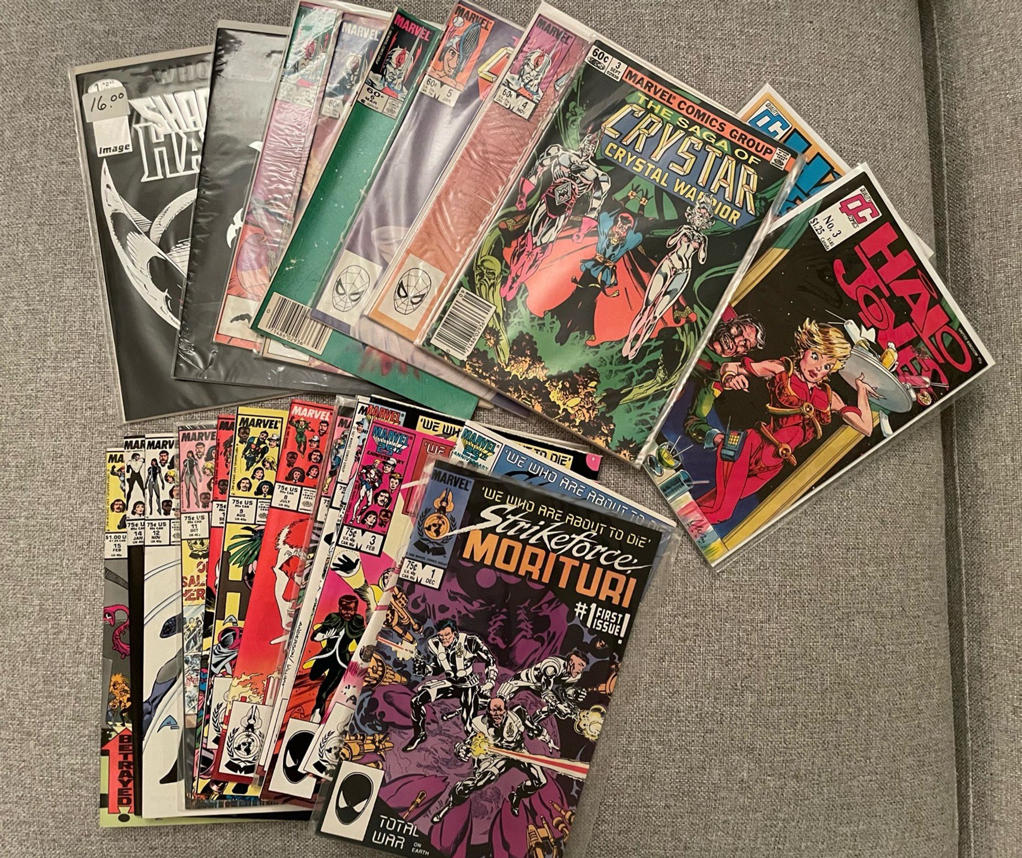 A pile of comics that includes the first 15 issues of Strikeforce Morituri and some miscellaneous ShadowHawk, Crystar, and Halo Jones comics.