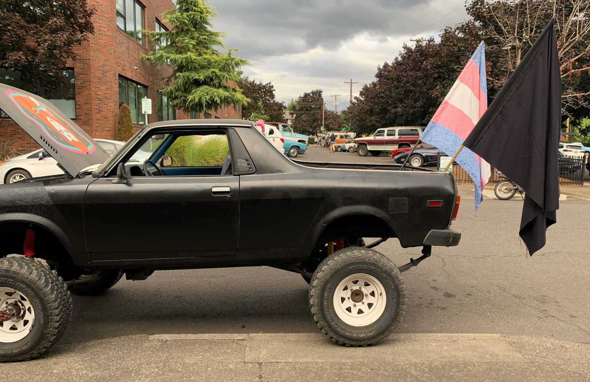 Subaru brat with a black and trans flag