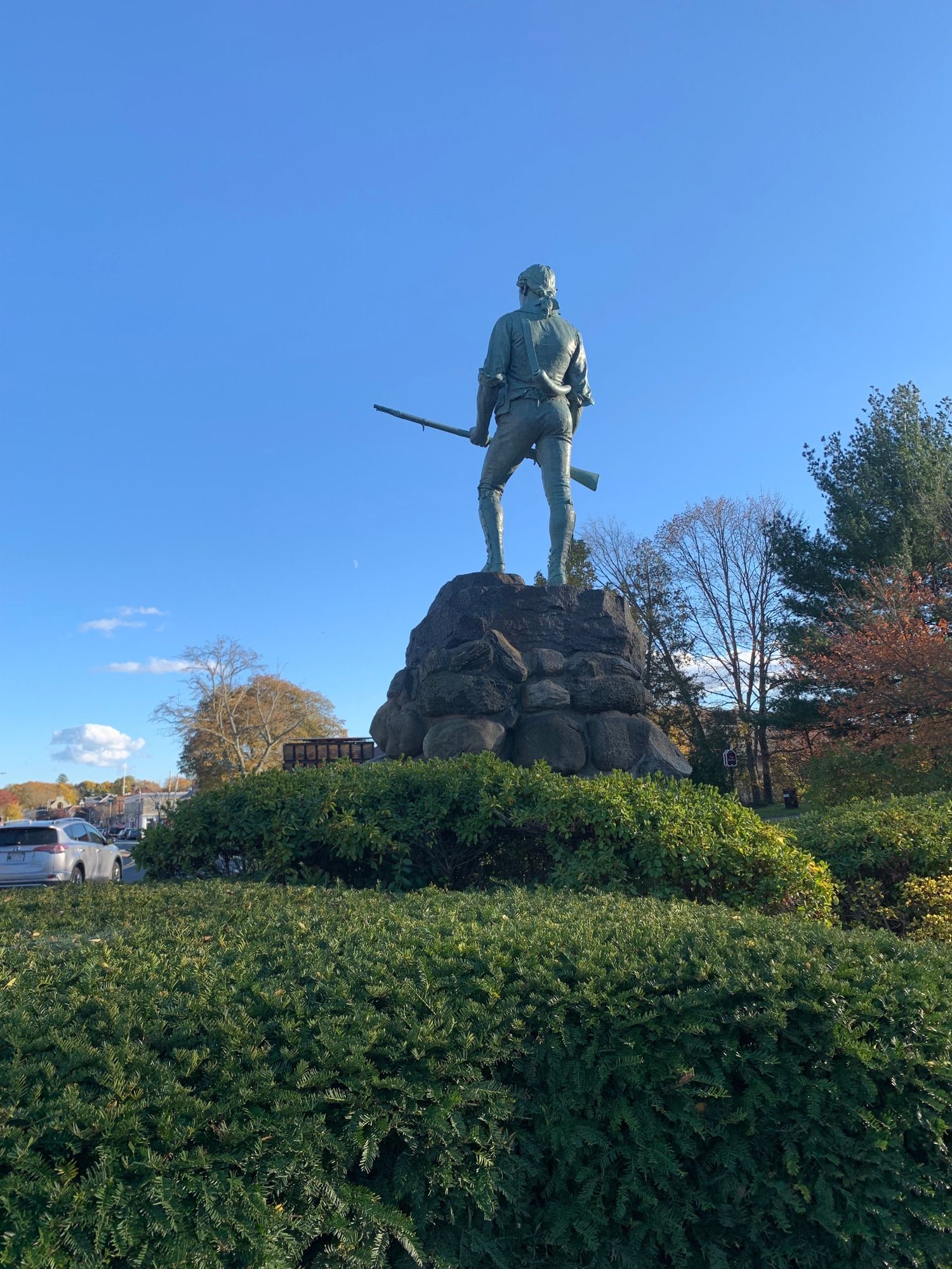 rear view of the statue of revolutionary war minuteman John Parker, who fought in the battle of concord 