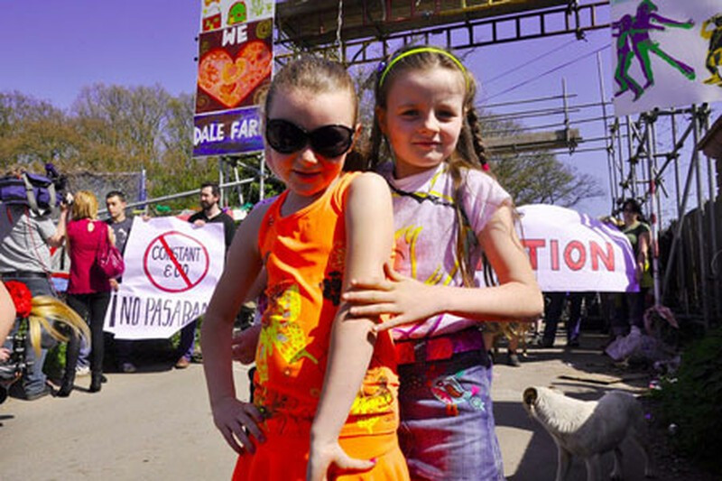 Two young Traveller girls aged about 9 or 10 stood in front of the scaffold tower at the from of Dale Farm Travellers' Site in Essex, in 2011.