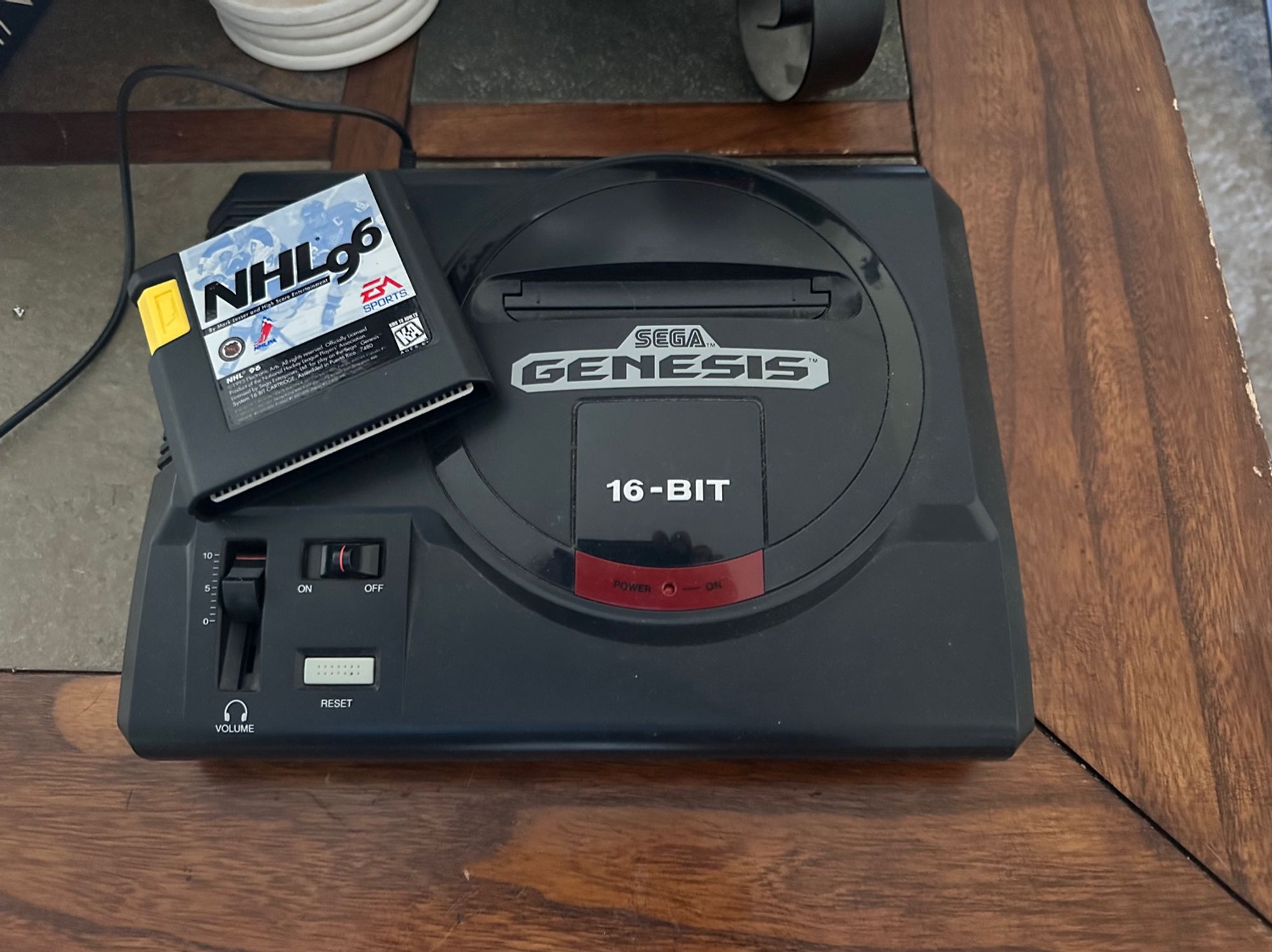 Sega Genesis 16-bit console with copy of NHL96 game.