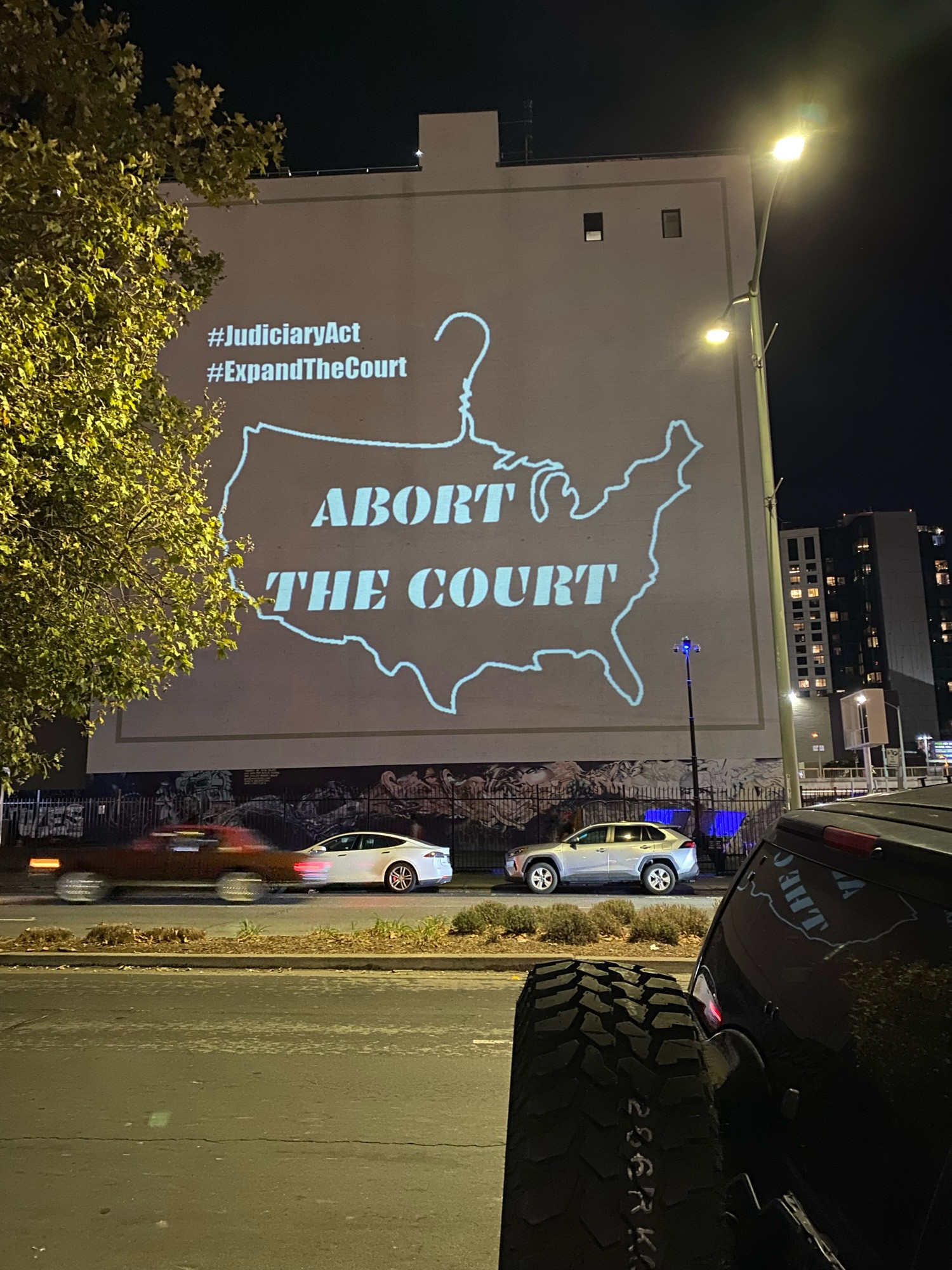 Clothes hanger design by @si.ti.ereh projected in Oakland