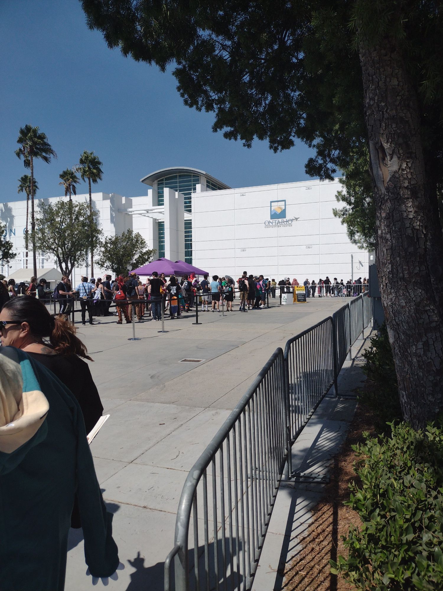 now at the front of Ontario Convention Center.  there is a security checkpoint under the purple tent.