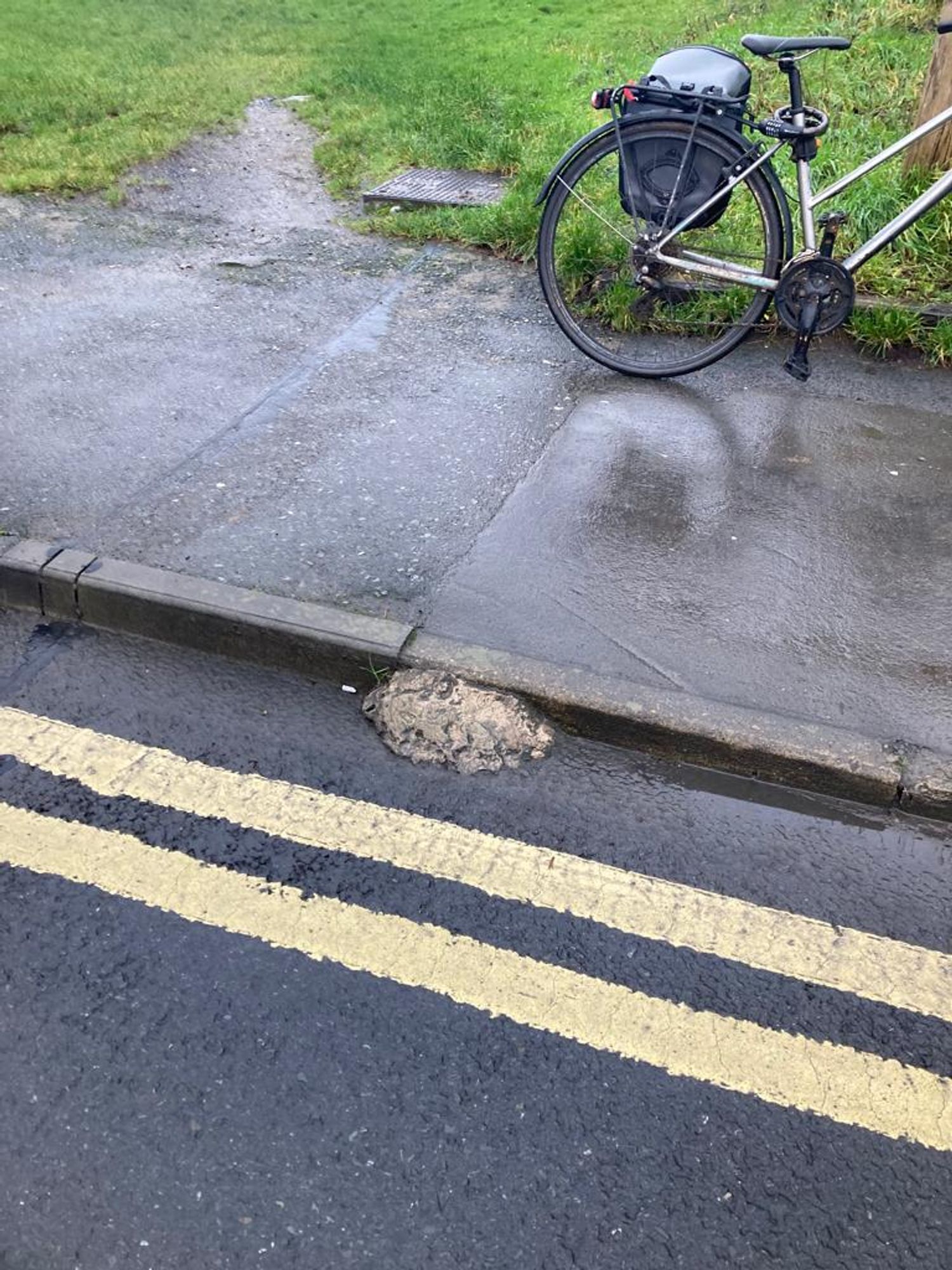 lump of concrete acts as a little ramp along a cycling desire line near the Plotts in Galway