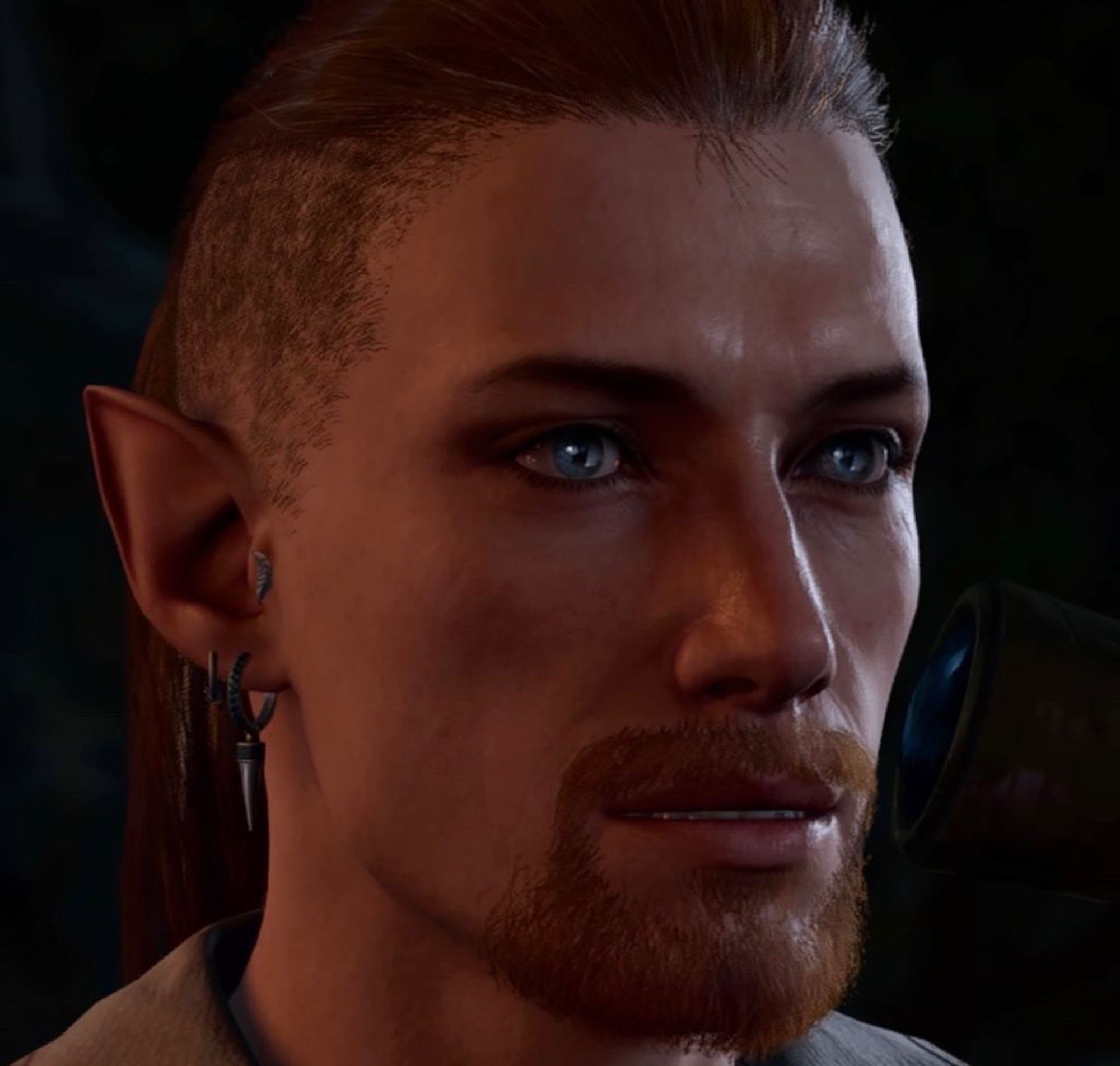 Jett’s “Baldur’s Gate 3” character, Dael (a light-skinned half-elf with greyish eyes and a goatee) gazing into the distance and looking vaguely like they’re having an existential crisis.