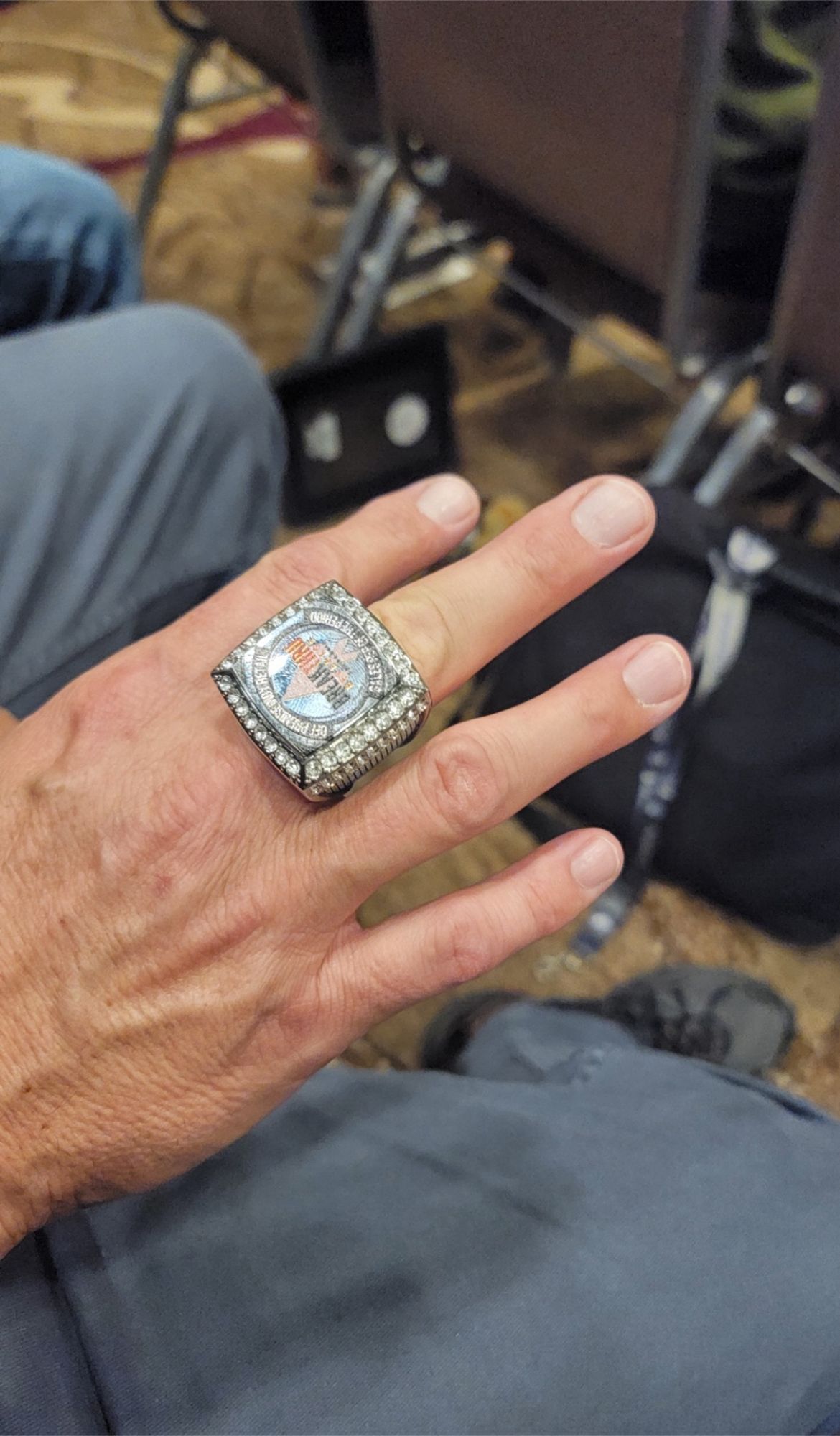 A giant ring with fake diamonds, company logo for an award